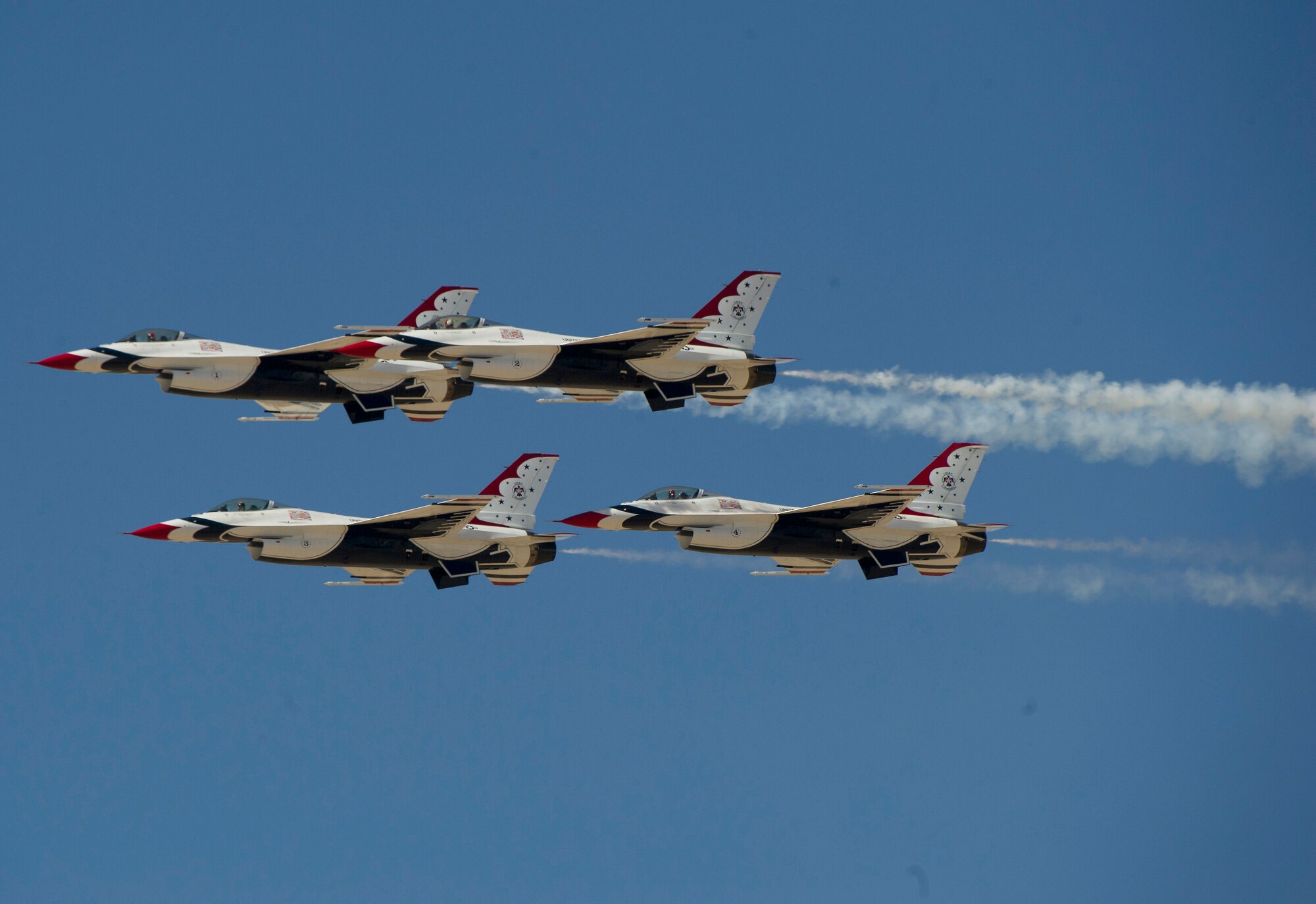 HOLLOMAN AIR FORCE BASE, N.M. -- Four F-16s of the U.S. Air Force Thunderbirds demonstration team perform aerial maneuvers Oct. 8, 2011, during their demonstration at the “Legacy of Liberty” Open House and Air Show. The team's primary mission is to exhibit the capabilities of modern, warfighting aircraft and to demonstrate the high degree of skill maintained by Air Force members serving in a variety of career specialties. (U.S. Air Force photo by Senior Airman DeAndre Curtiss / Released) 