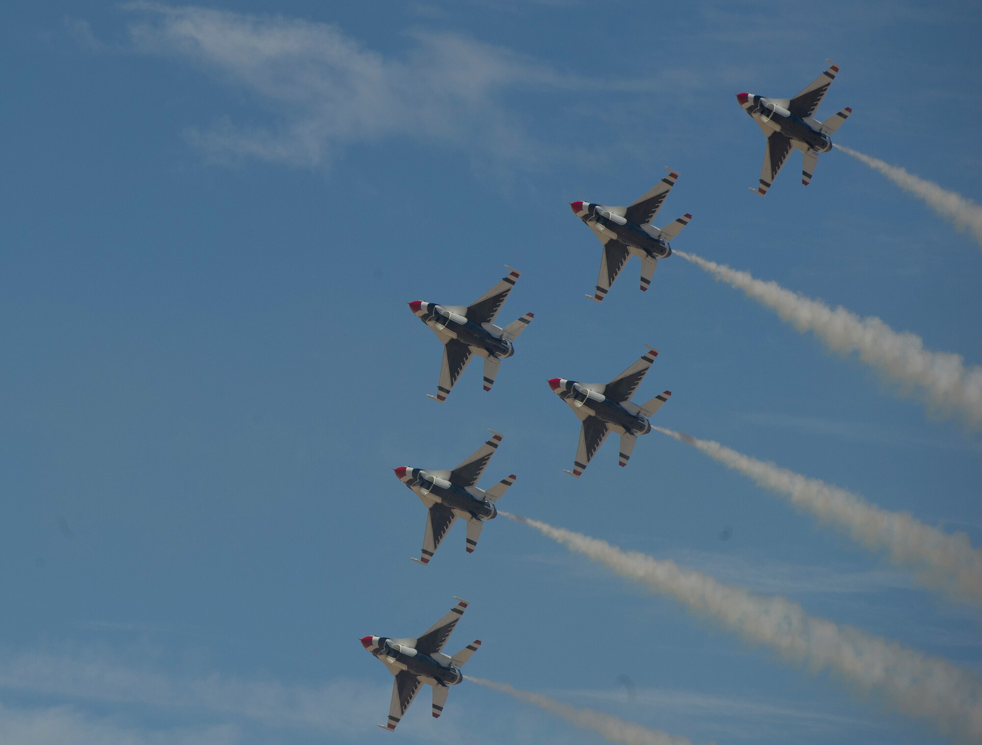 HOLLOMAN AIR FORCE BASE, N.M. -- Six F-16s of the U.S. Air Force Thunderbirds demonstration team perform aerial maneuvers Oct. 8, 2011, during their demonstration at the “Legacy of Liberty” Open House and Air Show. The team's primary mission is to exhibit the capabilities of modern, warfighting aircraft and to demonstrate the high degree of skill maintained by Air Force members serving in a variety of career specialties. (U.S. Air Force photo by Senior Airman DeAndre Curtiss / Released)