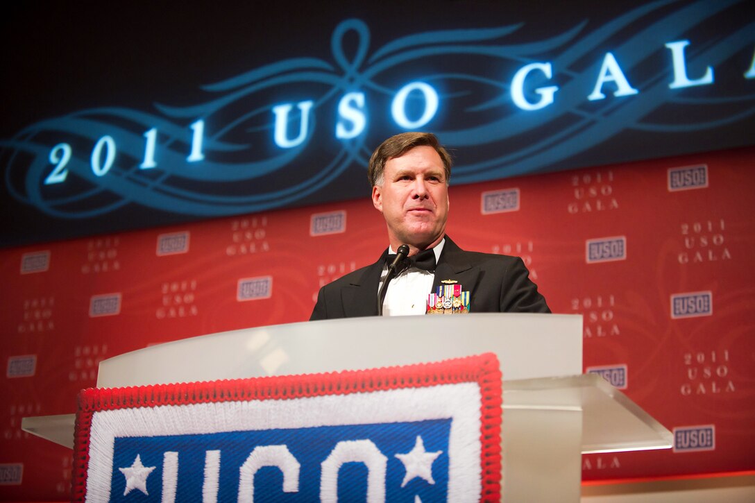Navy Adm. Mark E. Ferguson III, vice chief of naval operations, introduces Scott and Shirene Regelin, the parents of Petty Officer 1st Clas Chad R. Regelin, the USO Sailor of the Year, during the 2011 USO Gala in Washington, D.C., Oct. 6, 2011.