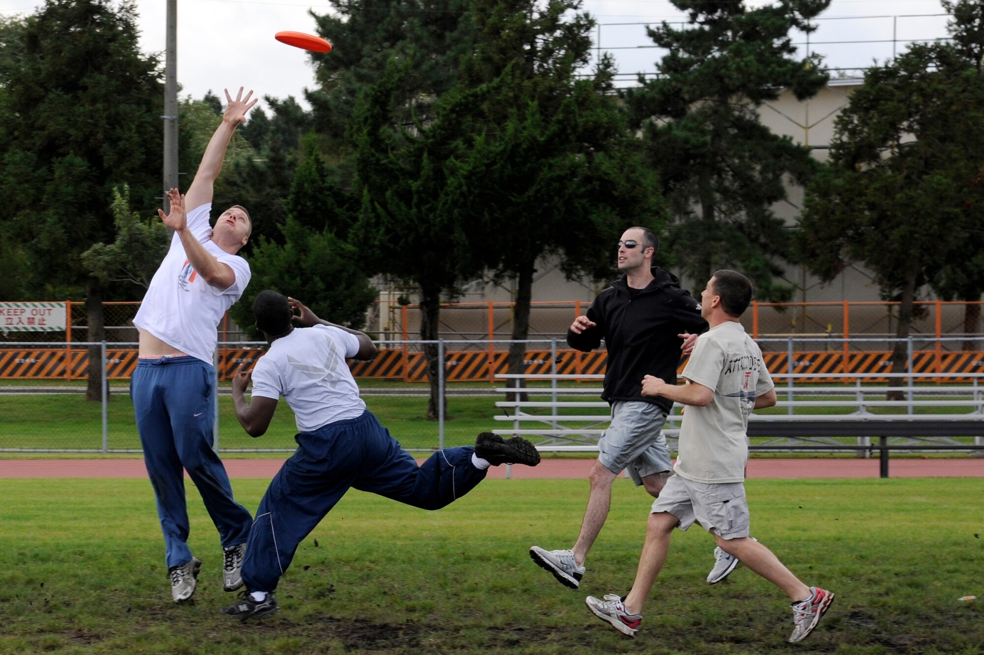MISAWA AIR BASE, Japan - Members of the 35th Operations Group compete against members of the 35th Security Forces Squadron in a game of ultimate frisbee during the wing sports day here Oct. 7. The 35th Fighter Wing held a sports day to promote physical fitness, teamwork, competition, sportsmanship and esprit de corps. The day was kicked off with a 3-mile run followed by various sporting events to include relay races, basketball, softball, ultimate frisbee, soccer and a readiness competition. Approximately 14 units from the base formed teams to participate in each event. (U.S. Air Force photo/Tech. Sgt. Marie Brown)