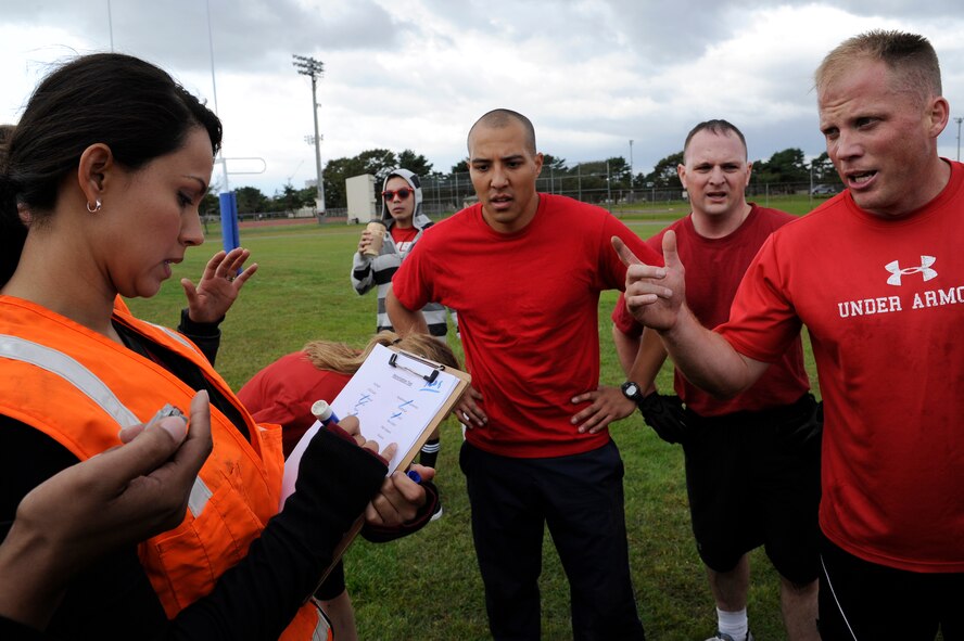 MISAWA AIR BASE, Japan - Members of the 35th Medical Group call out items they memorized for the memorization test in the readiness competition during the wing sports day here Oct. 7. The 35th Fighter Wing held a sports day to promote physical fitness, teamwork, competition, sportsmanship and esprit de corps. The day was kicked off with a 3-mile run followed by various sporting events to include relay races, basketball, softball, ultimate frisbee, soccer and a readiness competition. Approximately 14 units from the base formed teams to participate in each event. (U.S. Air Force photo/Tech. Sgt. Marie Brown)