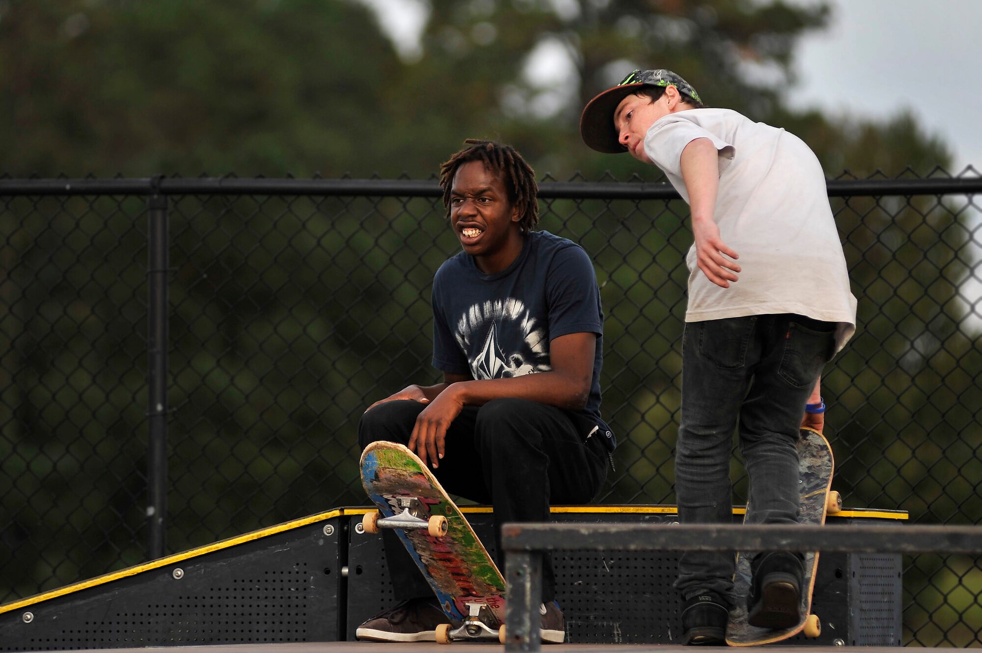 Patrick Kelly, (left) and Bryson Birht, watch as their friends skate during an afternoon session at the Sumter-Shaw Skate Park, Oct. 8, 2011, Sumter, S.C. The Sumter-Shaw Skate Park offers an alternative to military and civilian youth skating on the streets and provides them a safe environment to increase their skills to do what they love. (U.S. Air Force photo by Senior Airman Kenny Holston/Released)


