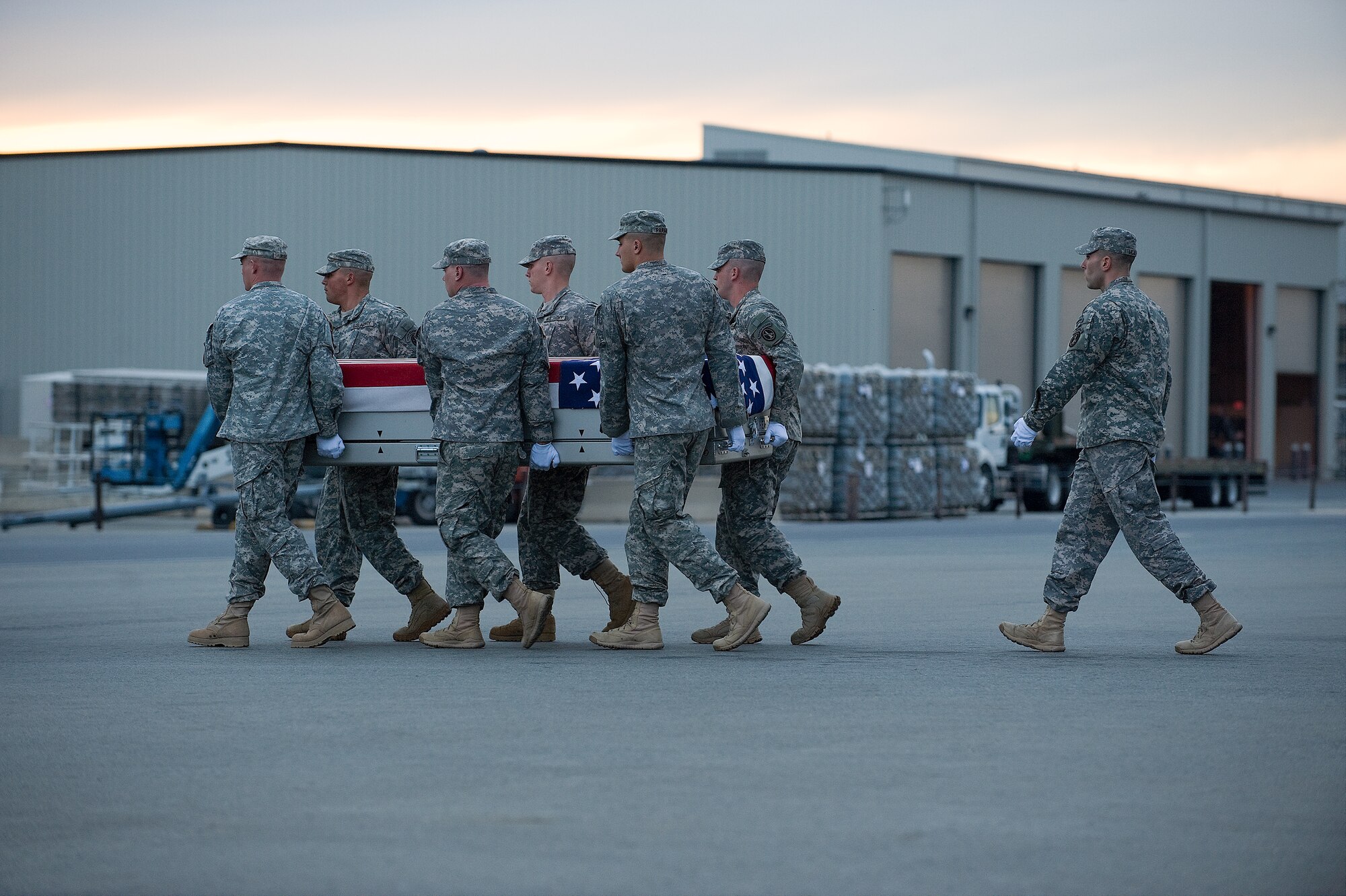 A U.S. Army carry team transfers the remains of Army Spc. Ricardo Cerros, of Salinas, Calif., at Dover Air Force Base, Del., Oct. 10, 2011. Cerros was assigned to the 2nd Battalion, 75th Ranger Regiment, Joint Base Lewis-McChord, Wash.(U.S. Air Force photo/Steve Kotecki)
