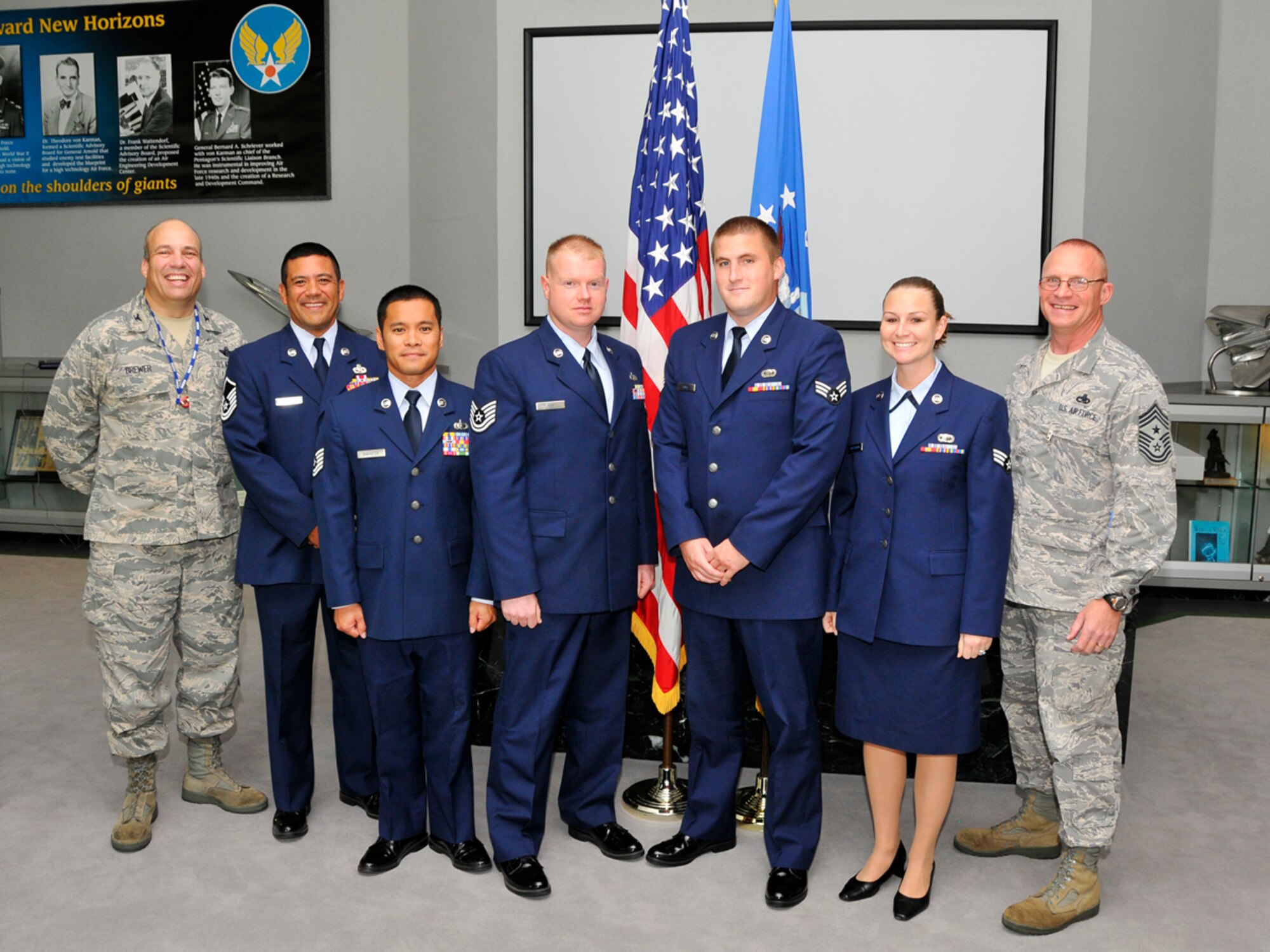 AEDC Commander Col. Michael Brewer, Master Sgt. Patrick Lazarus, Tech. Sgt. John Bankston, Tech. Sgt. James Key, Senior Airman Eric Ball, Senior Airman Tara Kindermann and Chief Master Sgt. Brian Randolph at the enlisted personnel graduation ceremony Sept. 22. (Photo by Rick Goodfriend)