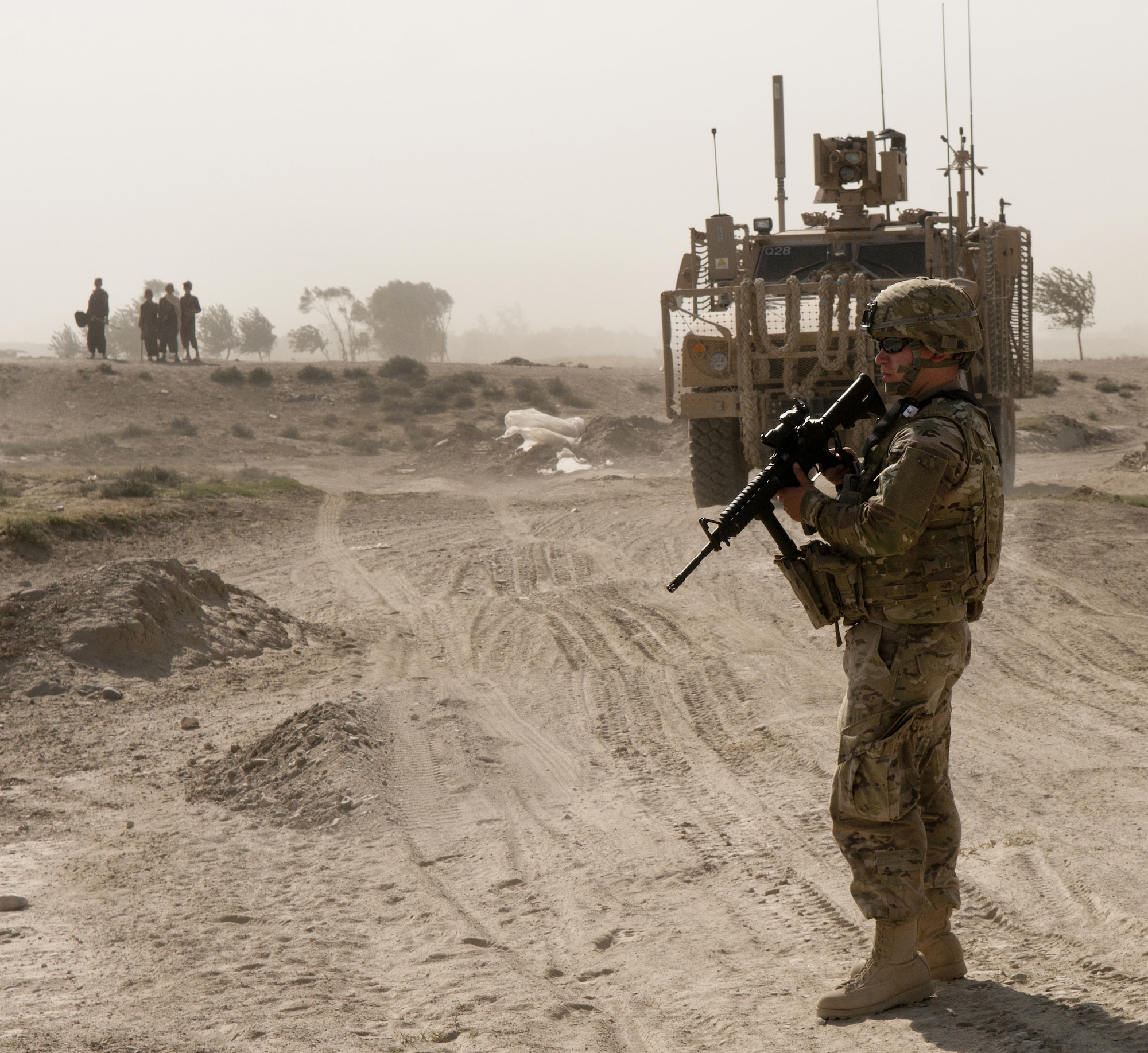 BAGRAM AIRFIELD, Afghanistan -- Senior Airman Jeffrey Hall, 455th Expeditionary Security Forces Squadron Quick Response Team leader, provides over watch security during a dismounted patrol outside the wire Sept. 26, 2011. Hall is deployed from Columbus Air Force Base, Mass., and is a native of Amery, Mass. (U.S. Air Force photo/Senior Airman Krista Rose)