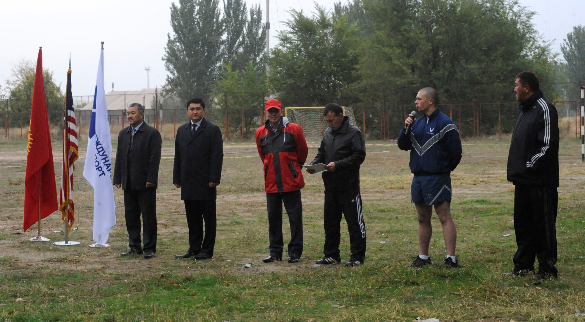 Senior Airman Michael Abrash translates during the opening of a sports competition at the Transit Center at Manas commemorating the 78th Anniversary of General Aviation in Kyrgyzstan Oct. 7. Twenty Airmen from the Transit Center participated in the day’s festivities. Abrash is a Theater Security Cooperation linguist deployed to the Transit Center from March Air Reserve Base, Calif. (U.S. Air Force photo/Staff Sgt. Patrick Maciejewski)