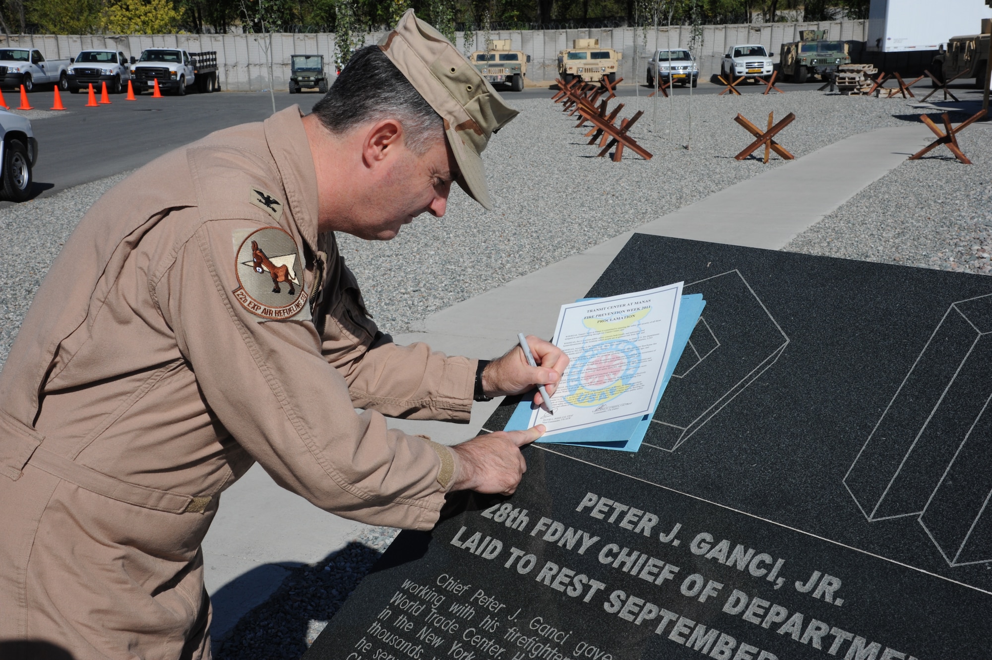 Col. Dave Pond, 376th Air Expeditionary Wing vice commander, signs a proclamation initiating Fire Prevention Week at the Transit Center at Manas, Kyrgyzstan, Oct. 9. The importance of fire prevention is underscored by the 2,565 preventable fire related deaths in the U.S. in 2009. Pond is deployed from the Pentagon.  (U.S. Air Force photo/Tech. Sgt. Hank Hoegen)