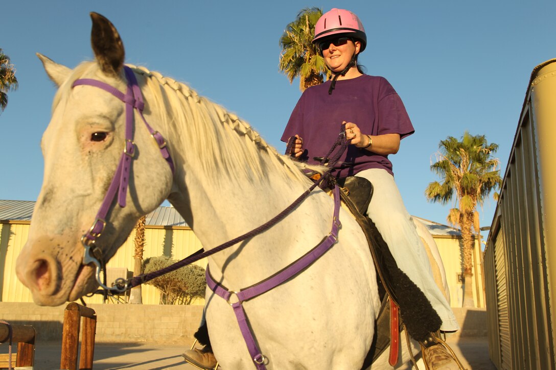 Navy Lt. Shelley Griffith, an environmental health officer at the Robert E. Bush Navy Hospital, rides her horse around the Outdoor Adventures stabels Oct. 11, 2011.