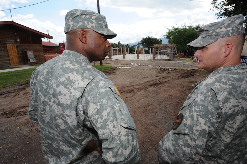 Maj. Gen Reuben D. Jones, (left) deputy commanding general for operations, U.S. Army Installation Management Command, talks with Col. Barry Graham, Army Support Activity commander, about the construction of a gym Oct. 3, 2011, at Soto Cano Air Base, Honduras. (U.S. Air Force photo/Tech. Sgt. Matthew McGovern)