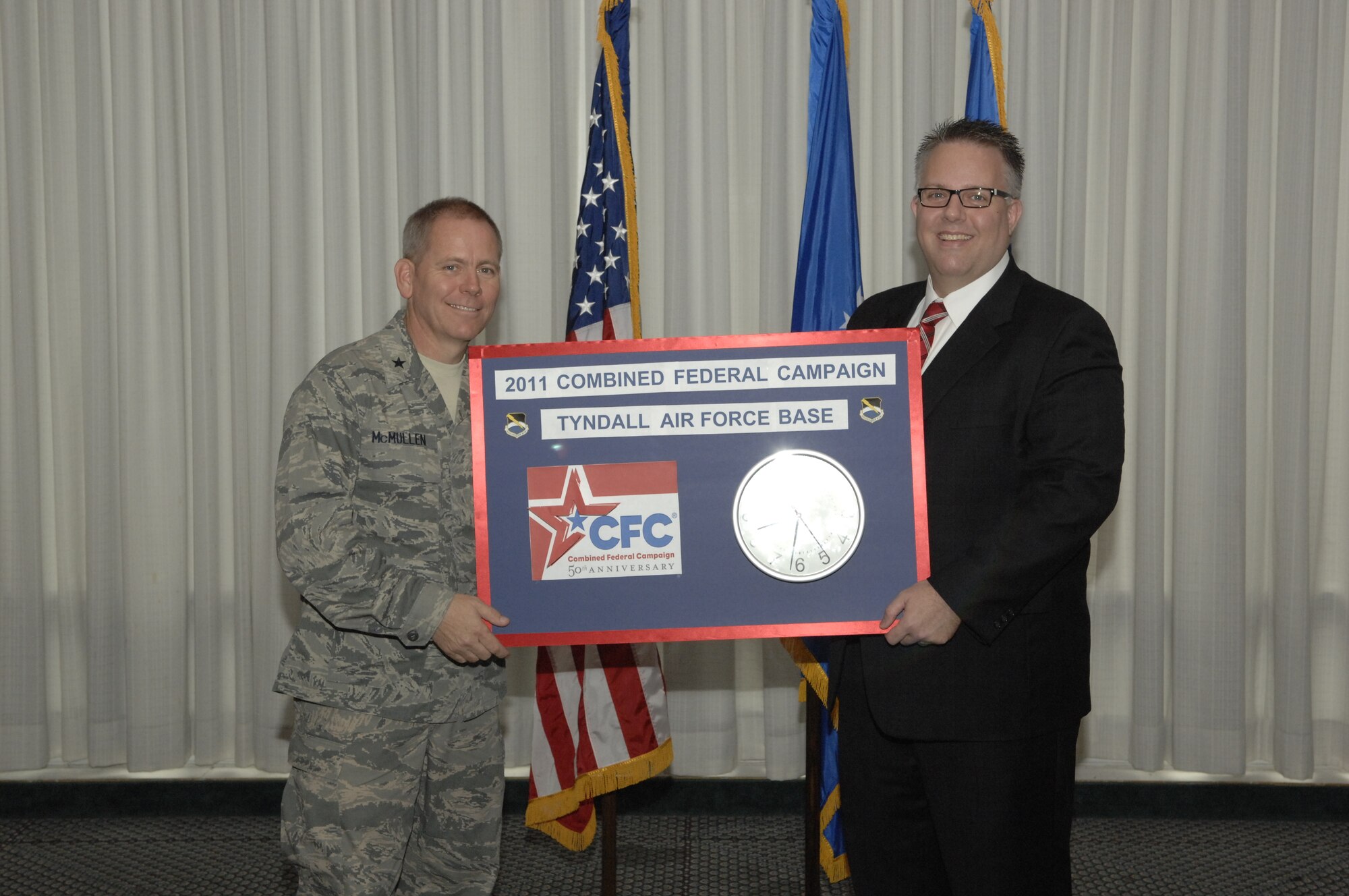Brigadier Gen. John K. McMullen, 325th Fighter Wing commander and Mr. Bryan Taylor, President of United Way of Northwest Florida, announce the official kick-off to the 2011 Combined Federal Campaign during a breakfast at the Heritage Club on Tyndall Oct. 11. The CFC provides Federal employees the opportunity to support local, national, and international philanthropic organizations. Last year, the CFC raised over $330,000 in the northwest Florida region. For more information or to donate, contact your unit CFC point of contact team member. (U.S. Air Force photo by Chris Cokeing)