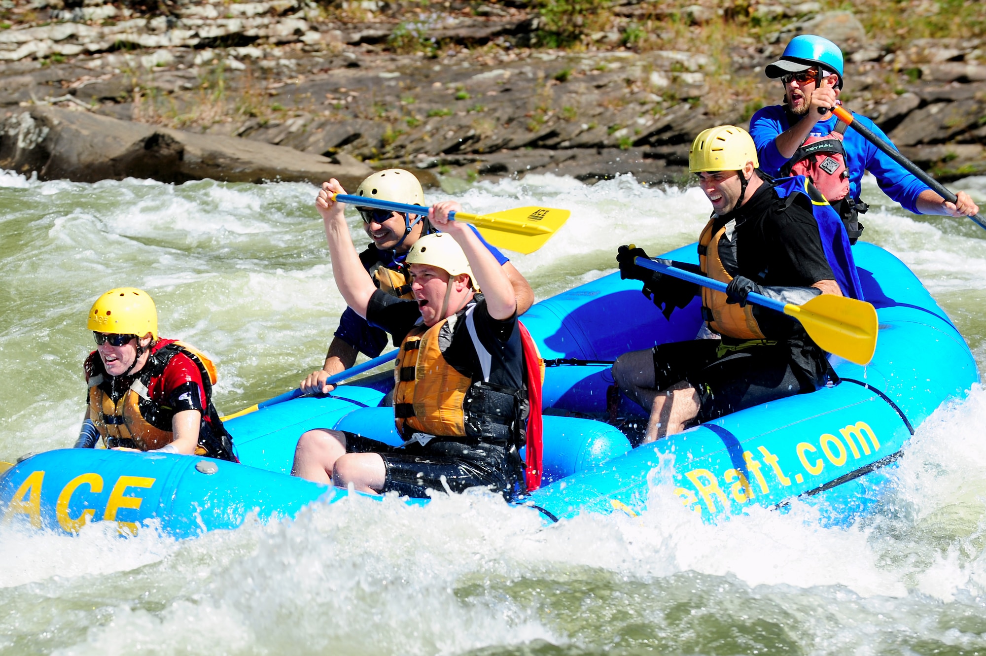 Members of Team America Global Police guide through the Gauley River during a 13-mile, white water race in Fayetteville W. Va., October 7, 2011. Team America Global Police is one of 29 teams that took part in the two-day, 52-mile, wilderness challenge. (U.S. Air Force photo by Airman 1st Class Kayla Newman/Released)