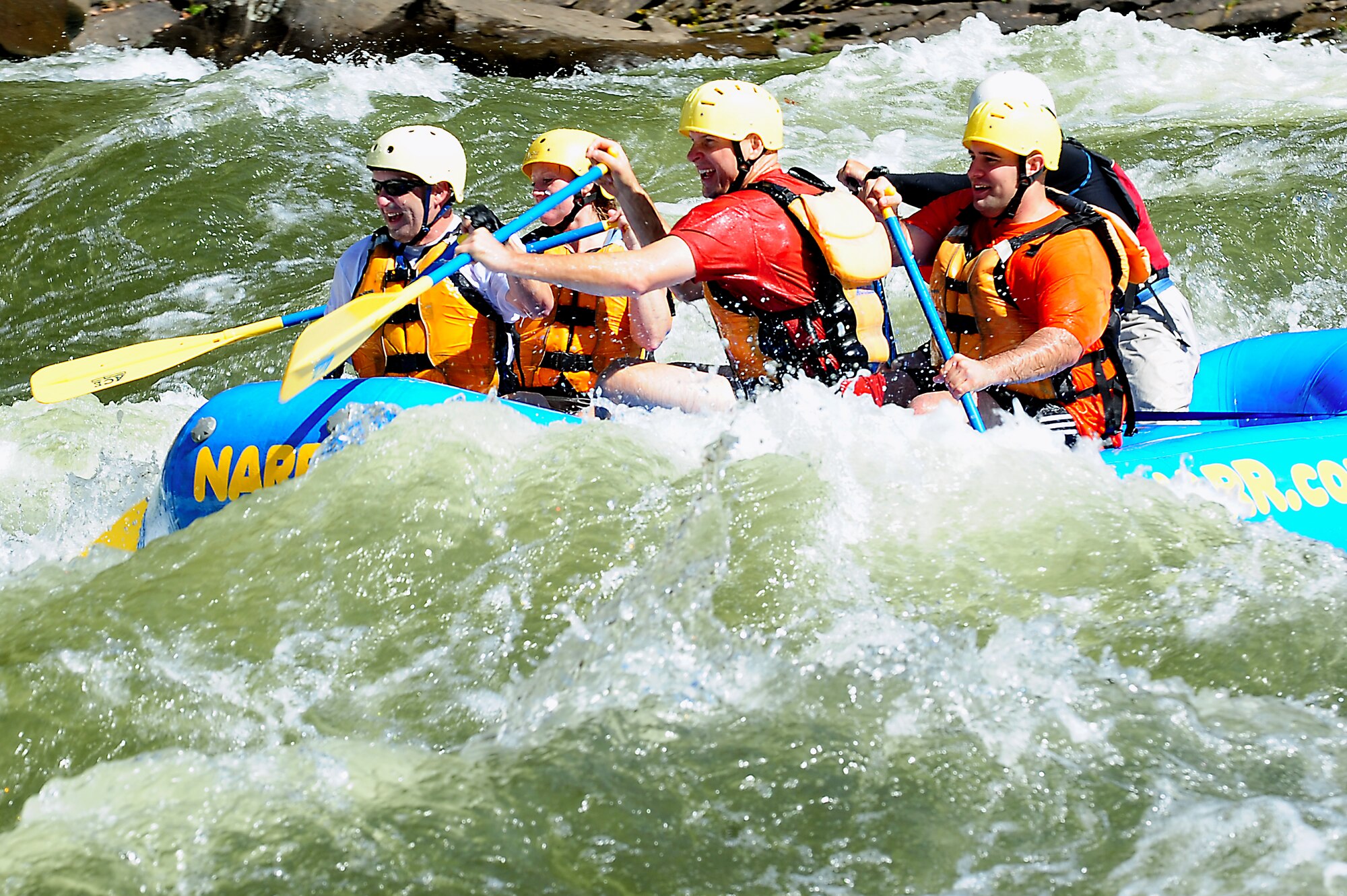 Members of Joint Task Force Civil Support Team paddle through Class V rapids on the Gauley River in Fayetteville W. Va., October 7, 2011. The 13-mile, white water race was one of five events scheduled during the 11th Annual Wilderness Challenge; in which 29 teams participated. (U.S. Air Force photo by Airman 1st Class Kayla Newman/Released)