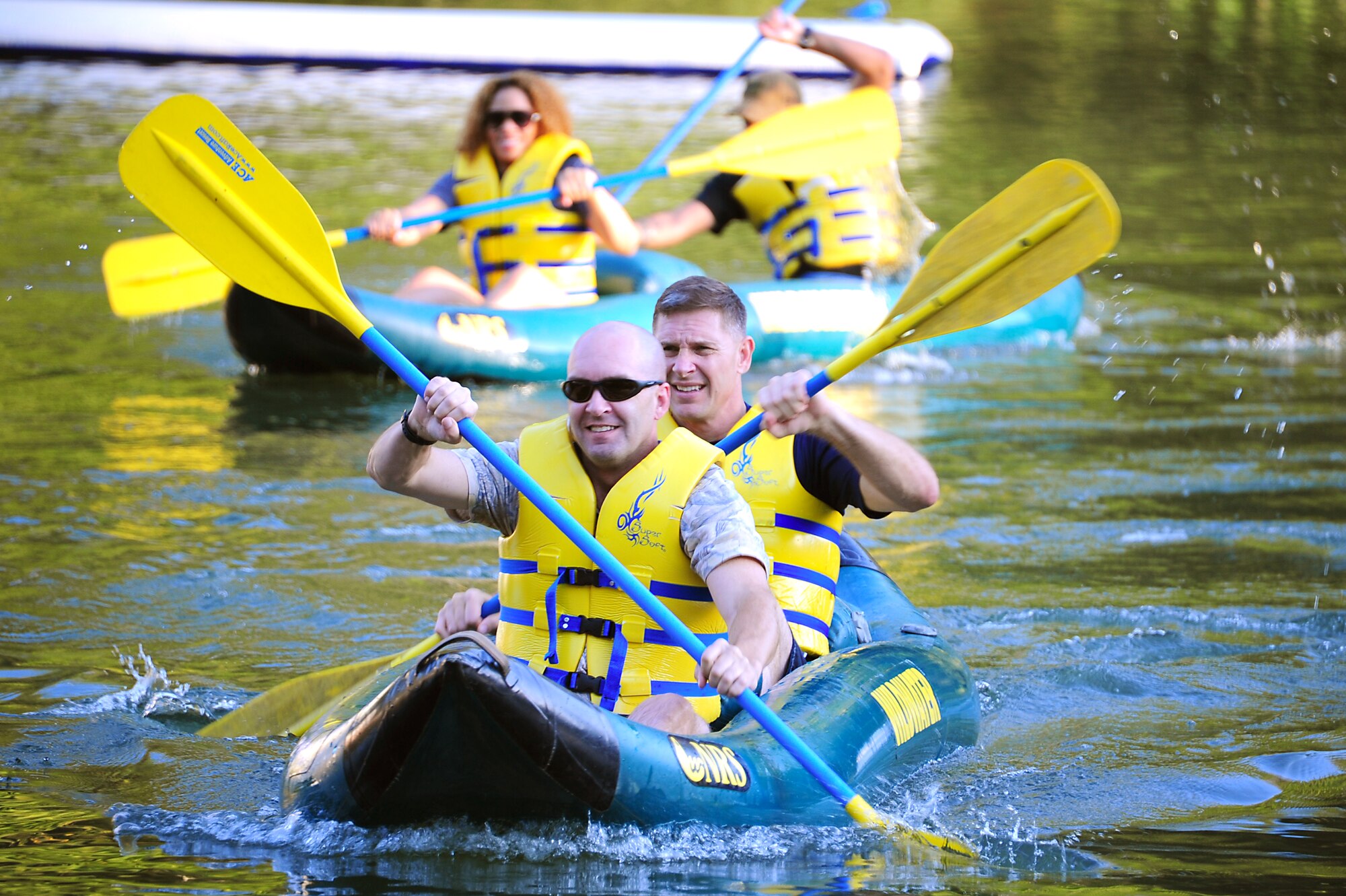 U.S. Marine Maj. Michael Olness, Joint Task Force Civil Support team member, and Col. Doug Schueler, JTFCS team captain, practice guiding a “duckie” before the 2011 Wilderness Challenge began at ACE Adventure Resort in Fayetteville W. Va., October 6, 2011. Participants raced their “duckies” for seven miles through Class I-III rapids along the New River. (U.S. Air Force photo by Airman 1st Class Kayla Newman/Released)