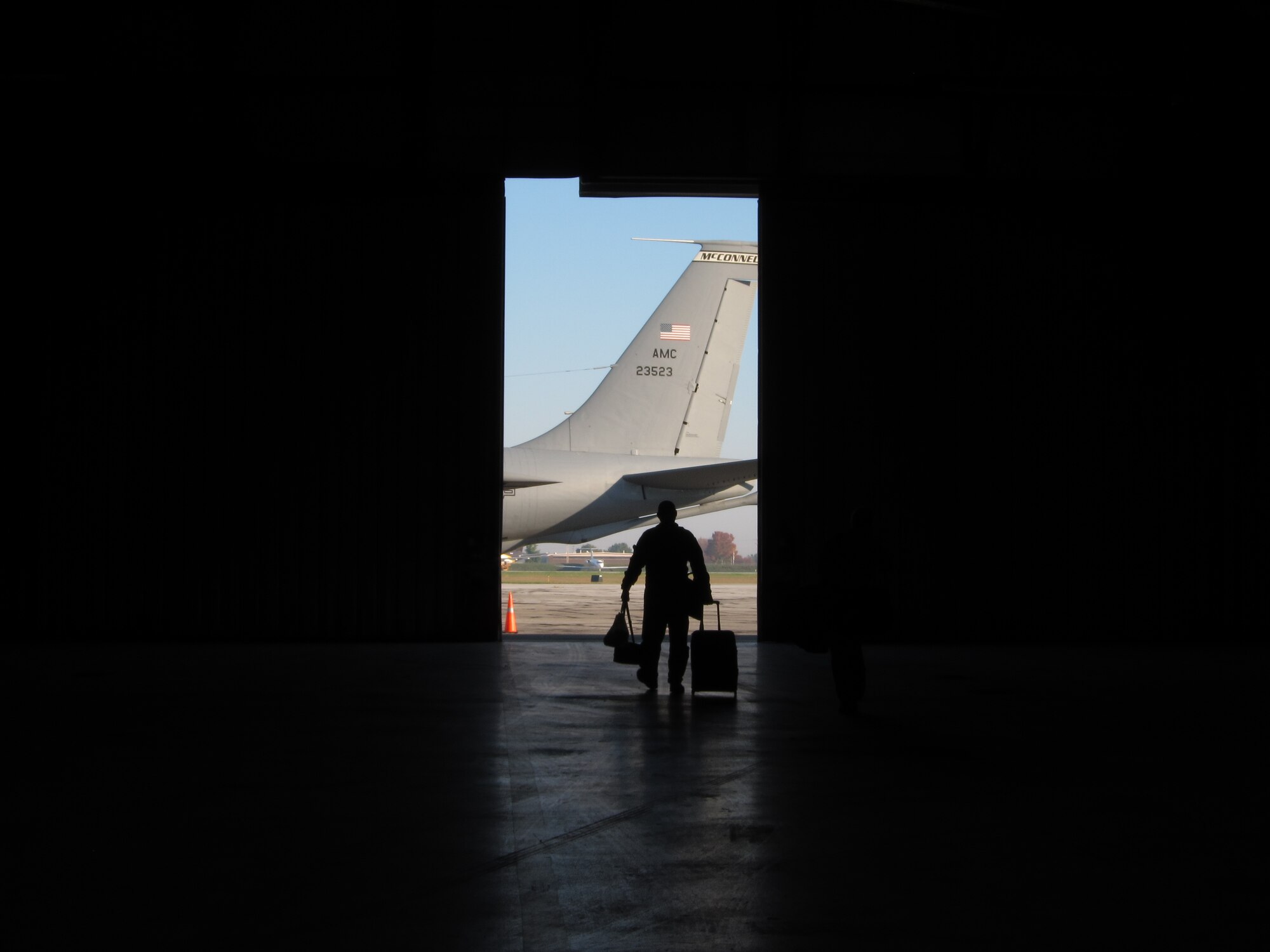 Maj. Larry Brown,22nd Operations Support Squadron, takes luggage to a KC-135 Stratotanker at the South Bend Airport in Indiana Oct. 9. The 931st Air Refueling Group and 22nd Air Refueling Wing Airmen provided transportation to athletic teams from the Air Force Academy, which was participating in numerous competitions in Indiana against the University of Notre Dame. (Air Force photo by Lt. Col. Tsuyoshi M. Tung)