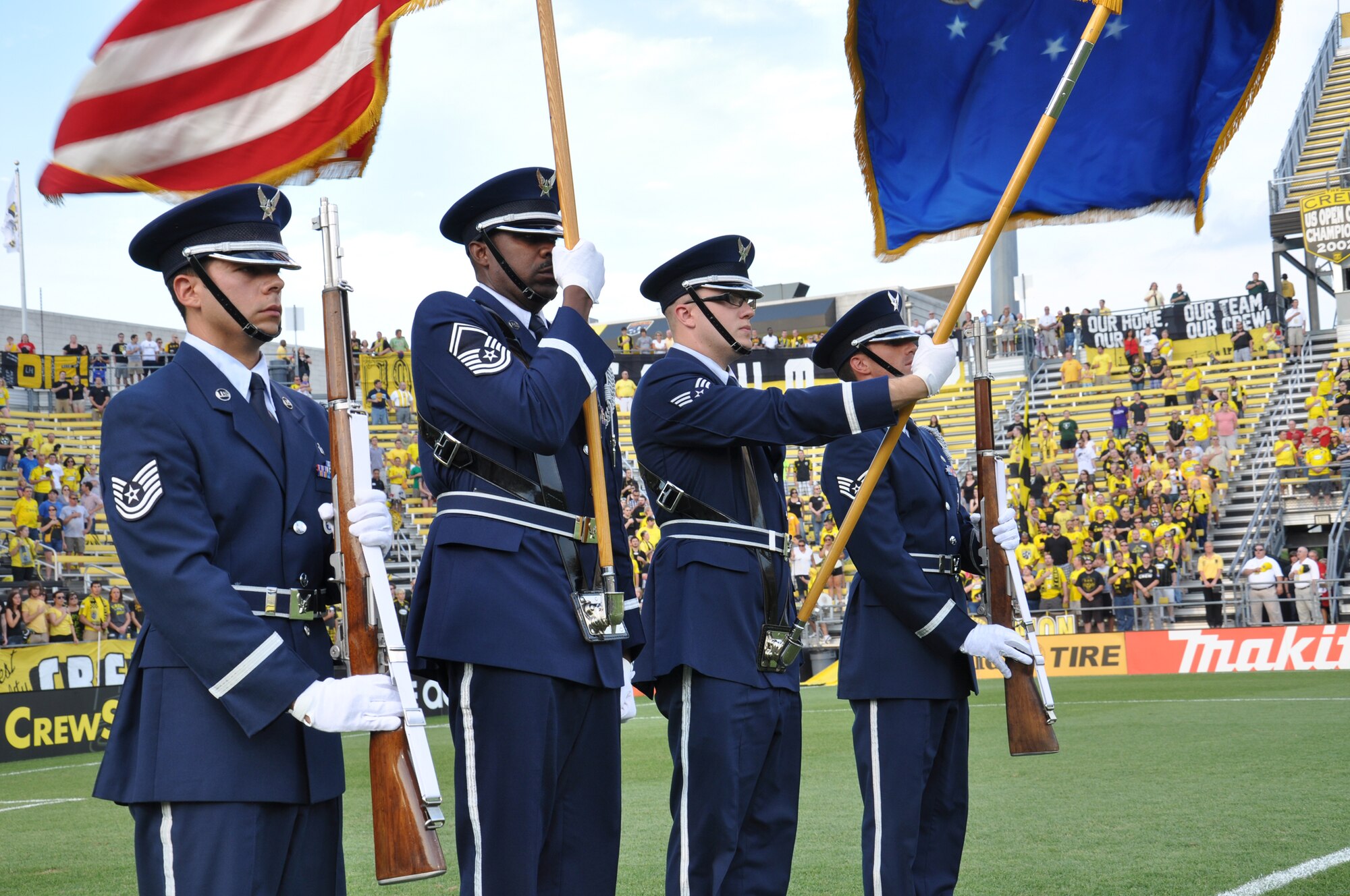 WRIGHT-PATTERSON AIR FORCE BASE, Ohio - Tech. Sgt. Jimmy Montalvo, Senior Master Sgt. Michael Bailey, Senior Airman Michael Young and Staff Sgt. Derick Lemmon from the Wright-Patterson Air Force Base Honor Guard perform during the pre-game ceremonies at Columbus Crew Stadium, Columbus, Ohio, Aug.13. (U.S. AIr Force photo/Staff Sgt. Rober Nelson)