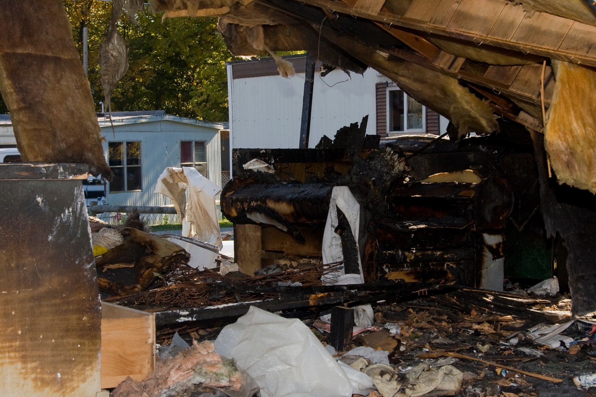 GRISSOM AIR RESERVE BASE, Ind. -- The inside of a local mobile home that burned in a fire near Grissom recently is seen here. Tech. Sgt. Damon Spradlin, 434th Aerospace Medicine Squadron bioenvironmental engineering craftsman, lived nearby the fire and heard an explosion that started it. Spradlin raced into the house looking for anyone trapped inside and found a golden retriever. He picked up the dog and ran out of the house, saving the animal's life. (U.S. Air Force photo/Tech. Sgt. Mark R. W. Orders-Woempner)

