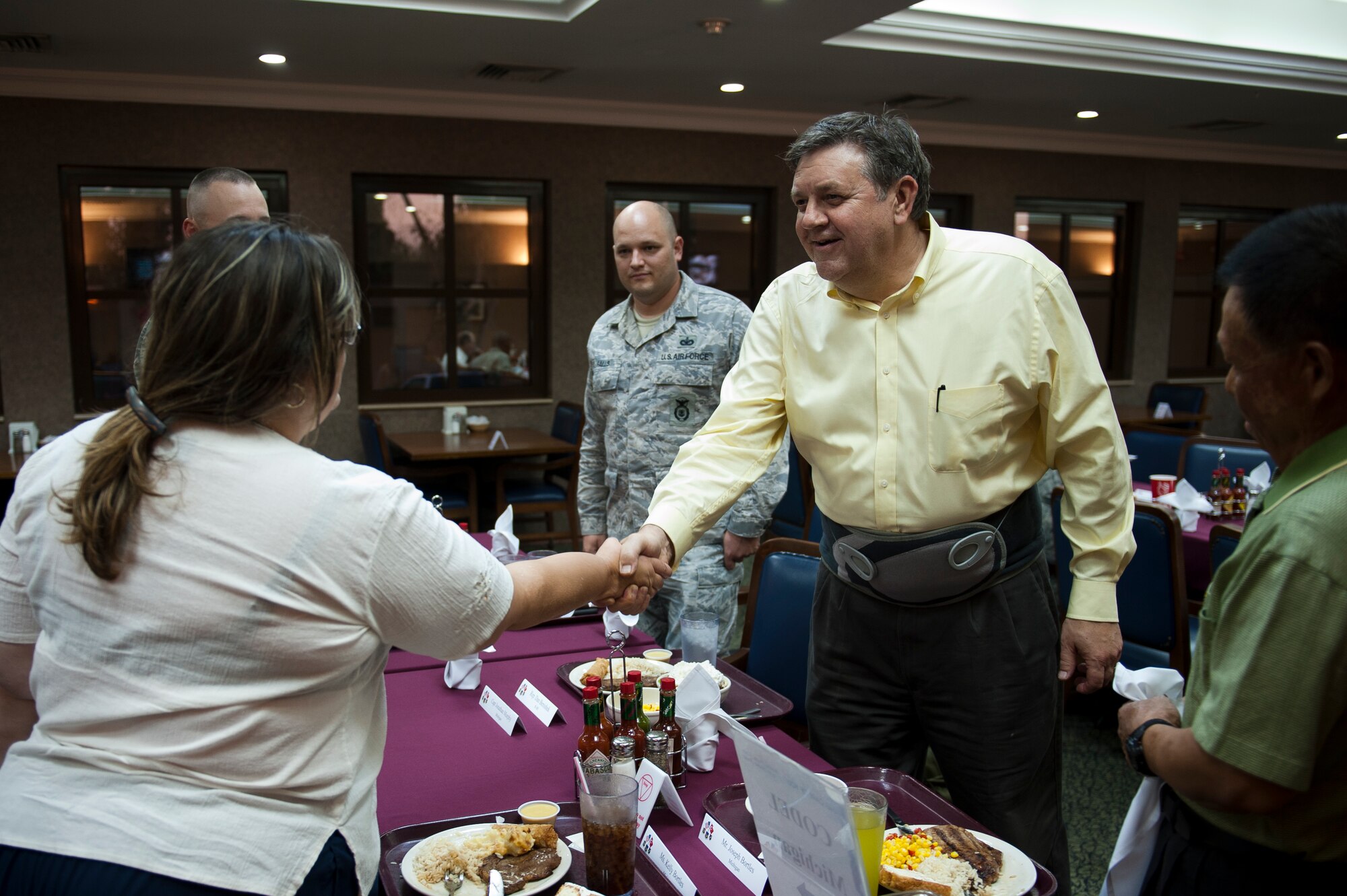 Rep. Dan Benishek of Michigan greets Airmen and civilians during a dinner Oct. 7, 2011, at Incirlik Air Base, Turkey. Benishek and congressional delegation members took the opportunity to meet with constituents from their respective states during a brief stop on their way to visit Airmen in Afghanistan. (U.S. Air Force photo by Tech. Sgt. Michael B. Keller/Released)
