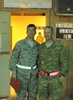Capt. Chris Woofer and Master Sgt. Stephen Woofter meet in Southwest Asia as they are bound for different missions. (USAF courtesy photo)