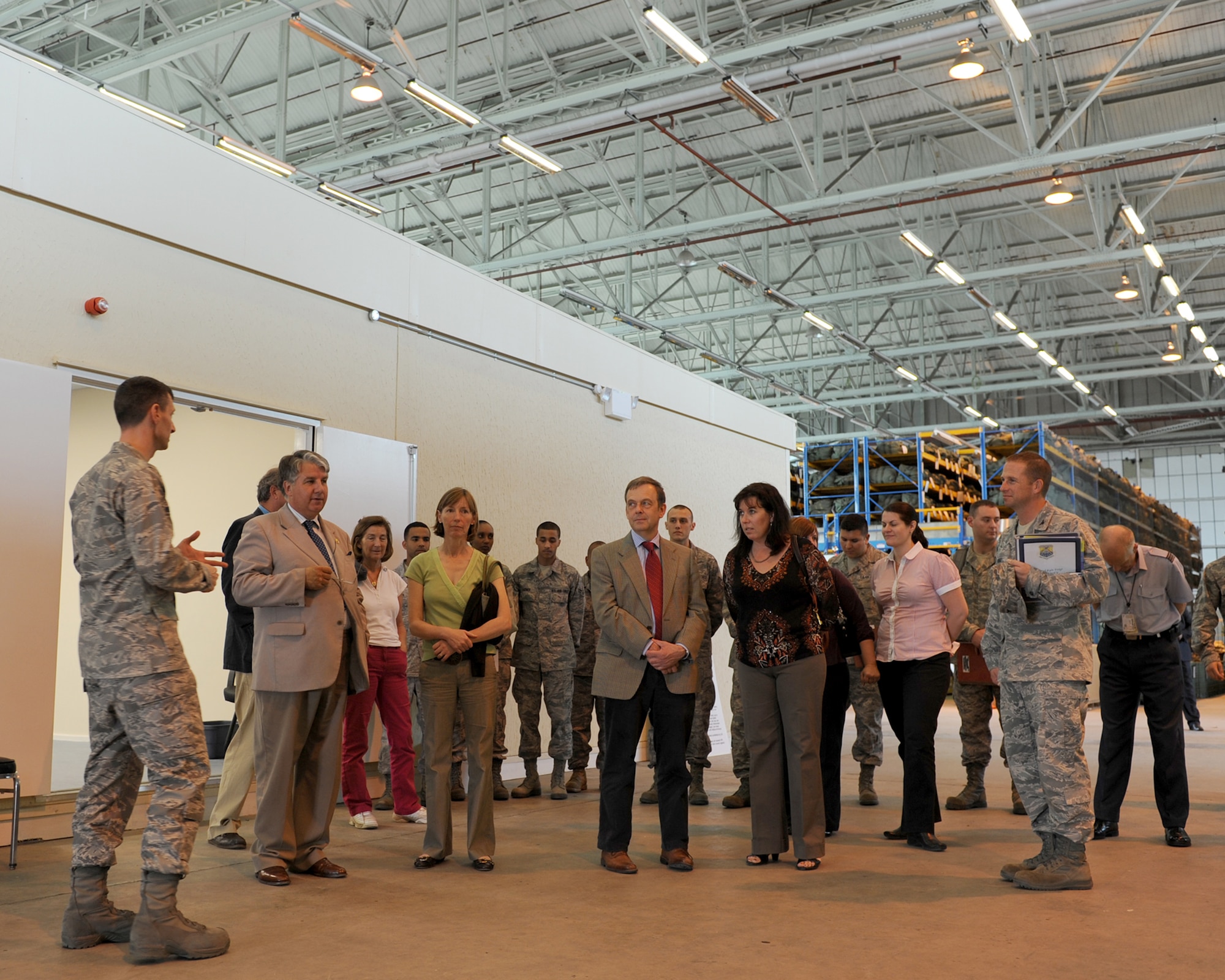 RAF MILDENHALL, ENGLAND - Maj. Timothy Voruz, left, 100th Logistics Readiness Squadron commander, briefs visiting high sheriffs and their spouses on the squadron’s mission here Oct. 3, 2011. The visiting sheriffs, Richard Barnwell, Cambridgeshire high sheriff; Georgina Holloway, Norfolk high sheriff; and Stephen Miles, Suffolk high sheriff, spent the day meeting Airmen and learning about the base’s mission as a way to strengthen relationships between the local and military communities.  (U.S. Air Force photo by Tech. Sgt. Neal Joiner)
