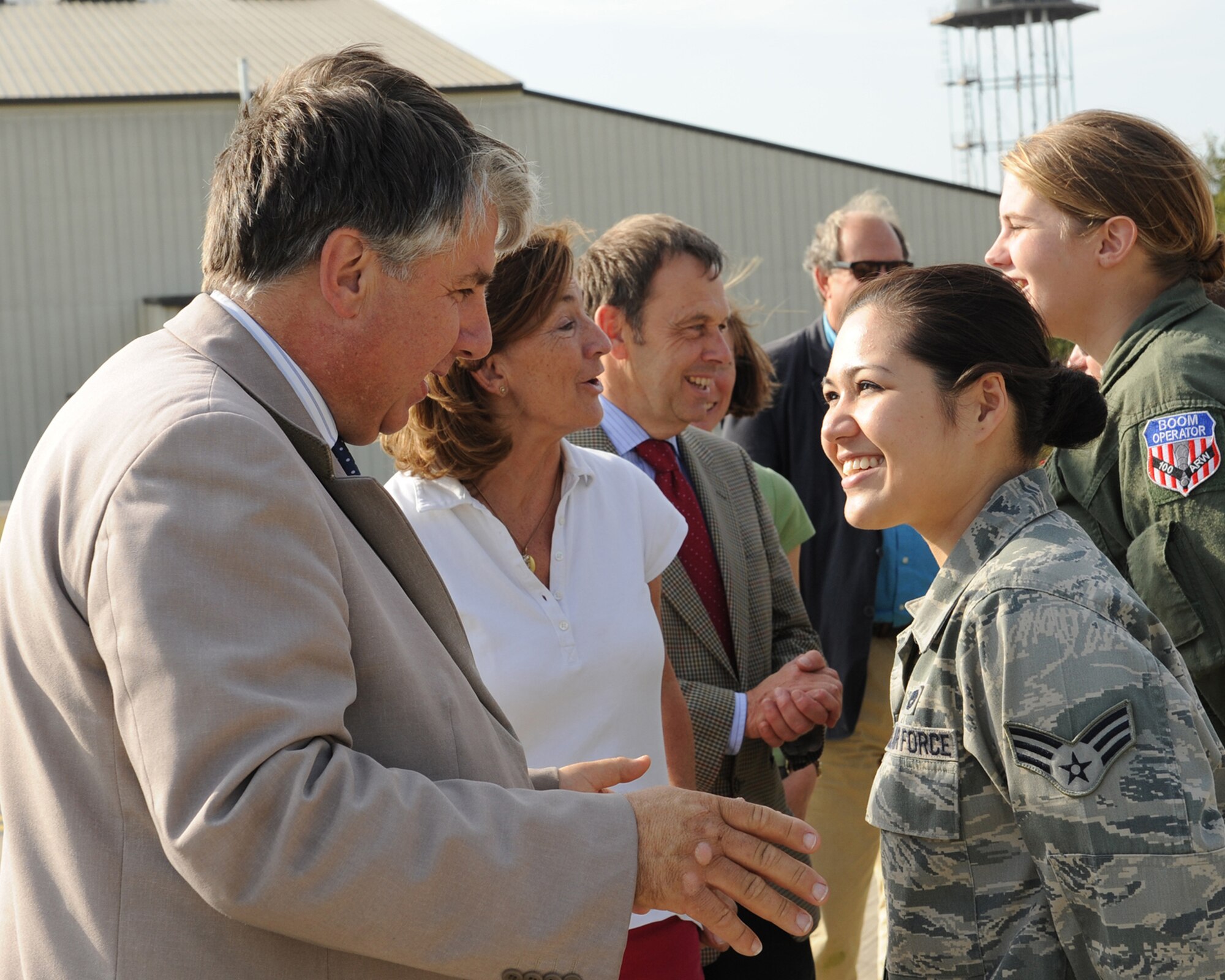 RAF MILDENHALL, ENGLAND - Richard Barnwell, high sheriff of Cambridgeshire, speaks with Senior Airman Stephanie Arnold, 100th Aircraft Maintenance Squadron, during his visit here Oct. 3, 2011. Barnwell visited the base along with Georgina Holloway, high sheriff of Norfolk, and Stephen Miles, high sheriff of Suffolk, and spent the day meeting Airmen and learning about the base’s mission as a way to strengthen relationships between the local and military communities.  (U.S. Air Force photo by Tech. Sgt. Neal Joiner)