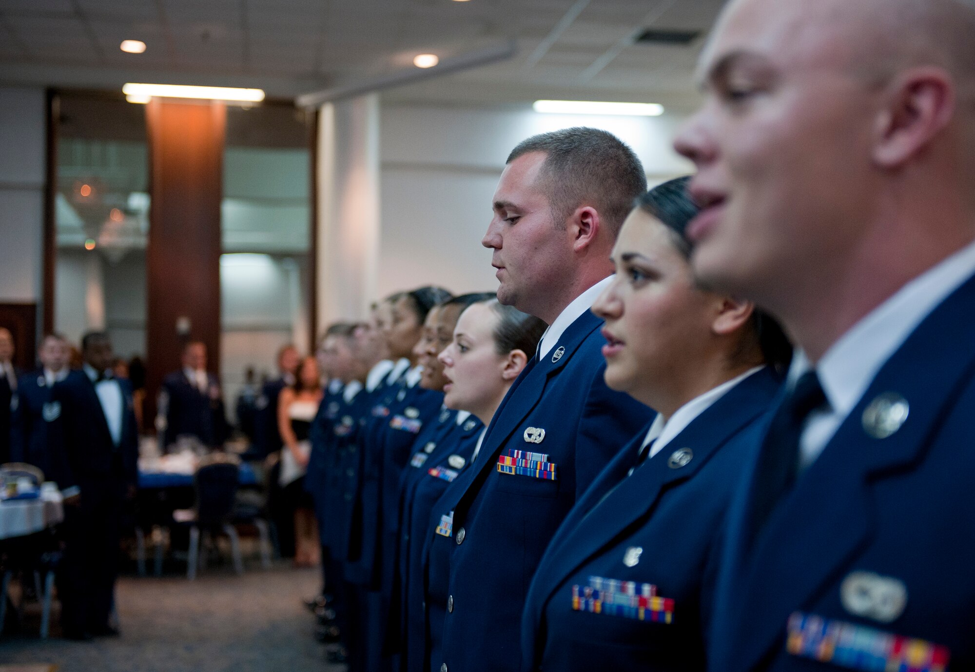 Incirlik Airman Leadership School Class 12-1 graduates sing the Air Force song during ALS graduation Oct. 7, 2011, at Incirlik Air Base, Turkey. There are four levels of professional military education: ALS, NCO academy, Air Force Senior NCO Academy and Chief Master Sergeant Leadership Course. (U.S. Air Force photo by Senior Airman Anthony Sanchelli/Released) 
