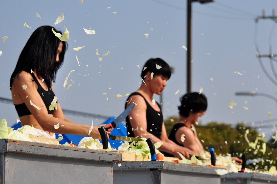 A Korean manta team performs Oct. 8, 2011, during the 10th Annual “BBQ & Blues” event hosted by the 51st Force Support Squadron at the parking lot near the Officers Club. This day of free food and fun was filled with barbecued ribs and the sounds of music pounding away at the eardrums. Eighteen groups started their day at about 7 a.m. to compete to be crowned the team with the best ribs on base. (U.S. Air Force photo/Tech. Sgt. Chad Thompson)