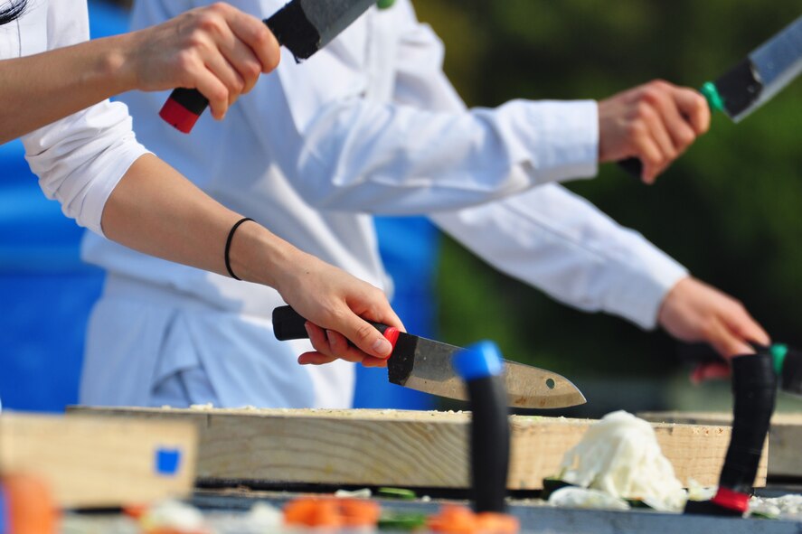 A Korean manta team performs Oct. 8, 2011, during the 10th Annual “BBQ & Blues” event hosted by the 51st Force Support Squadron at the parking lot near the Officers Club. This day of free food and fun was filled with barbecued ribs and the sounds of music pounding away at the eardrums. Eighteen groups started their day at about 7 a.m. to compete to be crowned the team with the best ribs on base. (U.S. Air Force photo/Tech. Sgt. Chad Thompson)