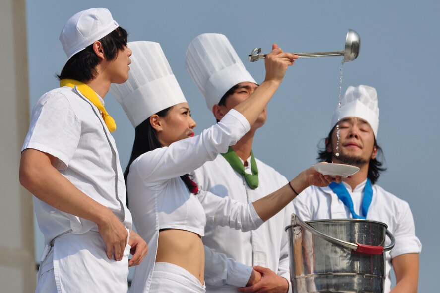 A Korean manta team performs Oct. 8, 2011, during the 10th Annual “BBQ & Blues” event hosted by the 51st Force Support Squadron at the parking lot near the Officers Club. This day of free food and fun was filled with barbecued ribs and the sounds of music pounding away at the eardrums. Eighteen groups started their day at about 7 a.m. to compete to be crowned the team with the best ribs on base. (U.S. Air Force photo/Tech. Sgt. Chad Thompson)