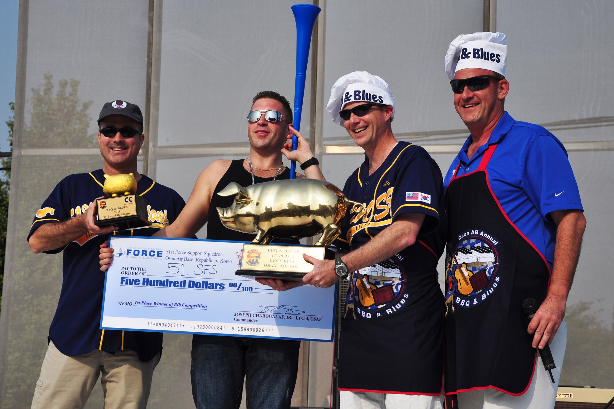 The 51st Security Forces Squadron was award second place in the best rib competition Oct. 8, 2011, during the 10th Annual “BBQ & Blues” event hosted by the 51st Force Support Squadron at the parking lot near the Officers Club. This day of free food and fun was filled with barbecued ribs and the sounds of music pounding away at the eardrums. Eighteen groups started their day at about 7 a.m. to compete to be crowned the team with the best ribs on base. (U.S. Air Force photo/Tech. Sgt. Chad Thompson)