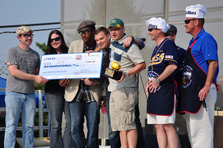 Osan's American Forces Network was award third place in the best rib competition Oct. 9, 2011, during the 10th Annual “BBQ & Blues” event hosted by the 51st Force Support Squadron at the parking lot near the Officers Club. This day of free food and fun was filled with barbecued ribs and the sounds of music pounding away at the eardrums. Eighteen groups started their day at about 7 a.m. to compete to be crowned the team with the best ribs on base. (U.S. Air Force photo/Tech. Sgt. Chad Thompson)