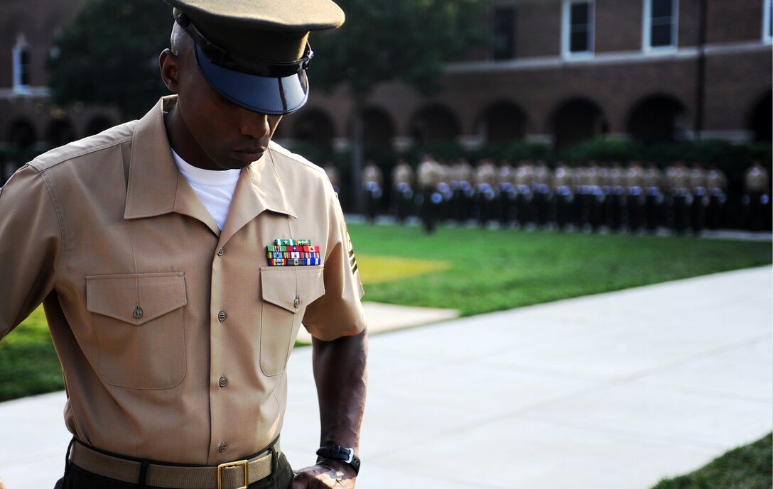 Master Sgt. Christopher Walker, Marine Barracks Washington drill master, observes the Barracks' ceremonial marchers as they practice for an Evening Parade May 20, 2011.