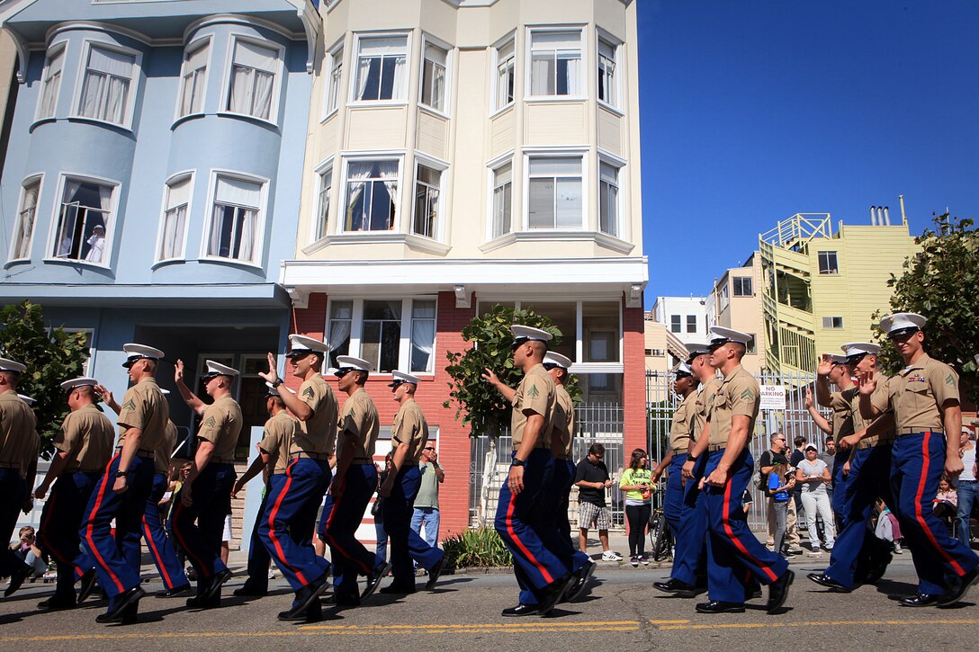 San Franciscans cheer for Marines serving with 1st Marine Expeditionary Brigade marching down Filbert Street during the 143rd Annual Italian Heritage Parade, Oct. 9, 2011. Marines and sailors with the expeditionary brigade traveled to San Francisco aboard the USS Bonhomme Richard to participate in Fleet Week to showcase the Navy and Marine Corps’ amphibious nature, readiness and ability to respond to disasters.