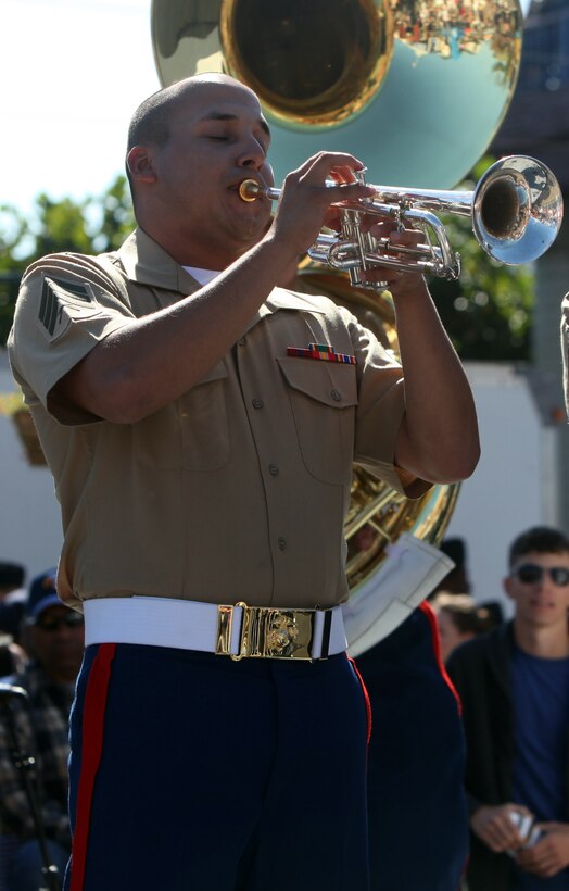 Sgt. Jacob Aguillon, a trumpet player with the 1st Marine Division Party Band, "Old Breed Brass," plays a solo during a free concert at Fisherman’s Wharf during San Francisco Fleet Week Oct. 8. With hundreds of local members enjoying the show, community events like the concert give the civilian community a better understanding of the military and show a lighter side of the Marine Corps.