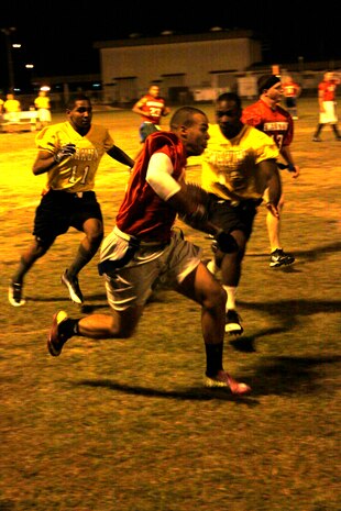 Seth P. Stringham, Blue Falcon’s wide reciever, runs an intercepted ball during a 2011 intramural flag football game at Penny Lake Fields here Oct. 12. Plays like Stringham’s interception gave the Blue Falcons the edge needed to earn the win.