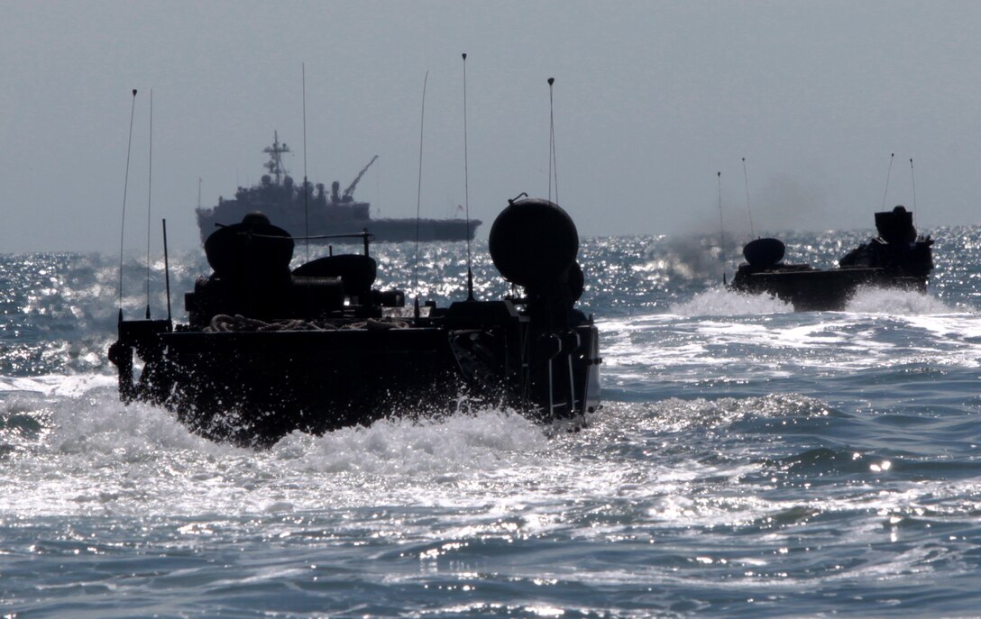Two amphibious assault vehicles with 2nd platoon, Company B, 2nd Assault Amphibian Battalion, 2nd Marine Division, moves toward the USS Ponce during the amphibious assault training conducted at Onslow Beach aboard Marine Corps Base Camp Lejeune, N.C., Oct. 12. Throughout the training, the AA Bn. was supported by the USS Ponce, an Austin-class amphibious transport dock named for Ponce, Puerto Rico, a city in the commonwealth of Puerto Rico.