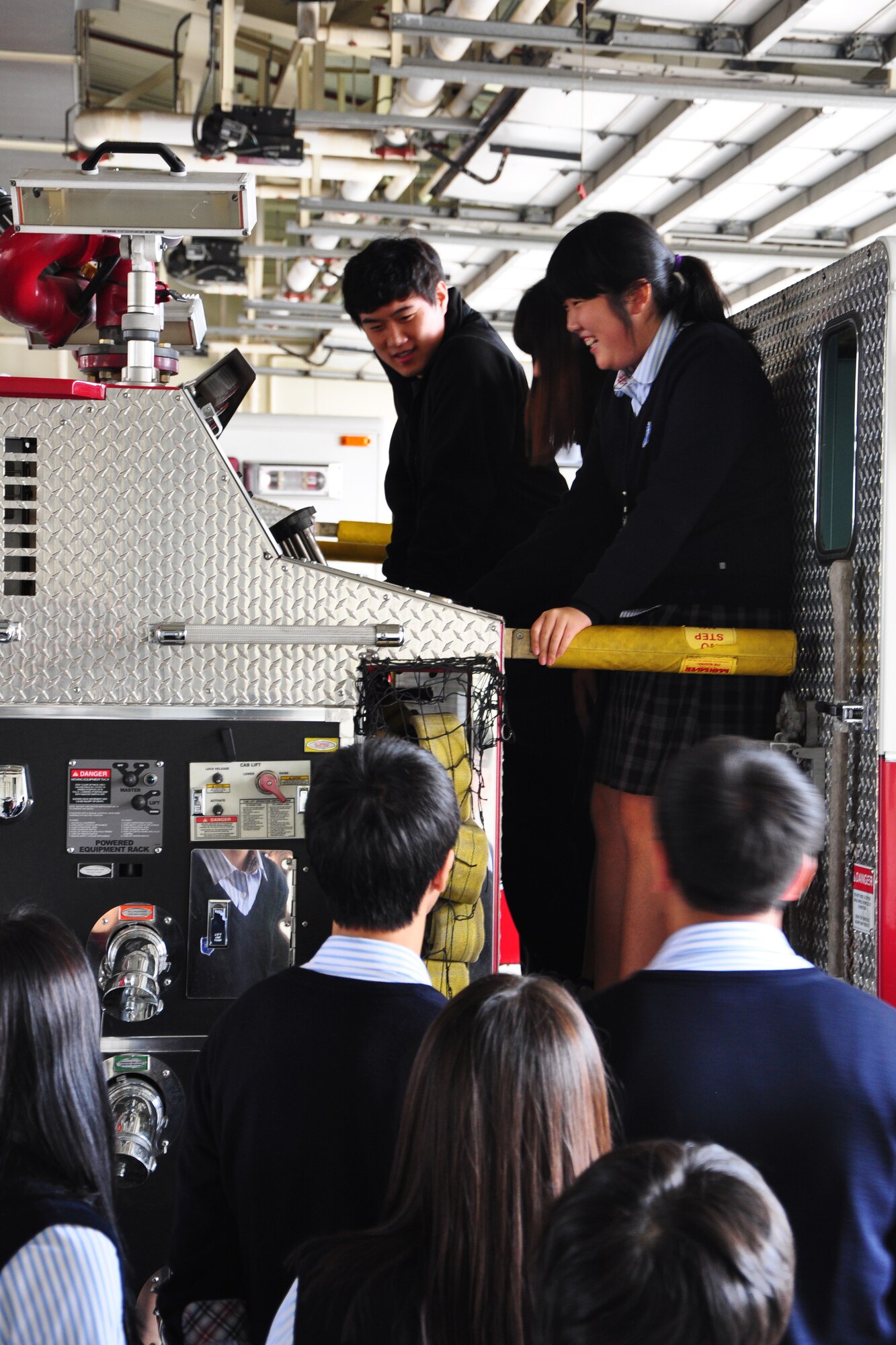 Korean middle school students are shown a control panel of one of the Osan Fire Department’s trucks during a visit to the Osan Fire Department Oct. 12, 2011. As a part of Fire Prevention Week, 21 students from a local Korean middle school toured the Osan Fire Department and got to see firsthand how a firefighter lives day to day. The students got to see several tools of the trade, learned about what a firefighter’s day is like and got a fire truck and ladder truck demonstration. Fire Prevention Week is the longest running public health and safety observance on record. (U.S. Air Force photo/Tech. Sgt. Chad Thompson)
