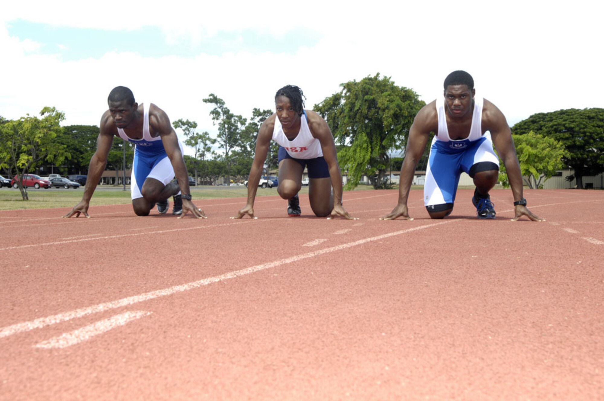 A1C Michael Garel, Tech. Sgt. Charity Barrett, and A1C Andrew Robinson are Oahu airmen and members of the U.S. Air Force Track Team who competed in the 2011 annual NATO Track and Field Championship in Heusden-Zolder, Belgium on Sept. 7.  Photo by (David D. Underwood, Jr.)