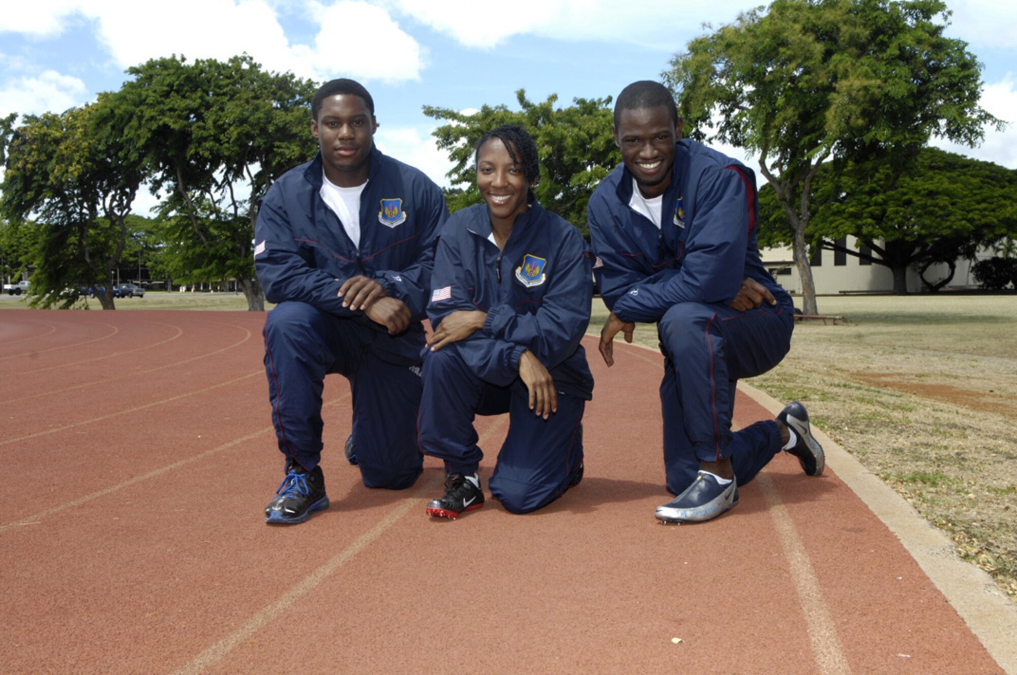 A1C Andrew Robinson, Tech. Sgt. Charity Barrett, and A1C Michael Garel are Oahu airmen and members of the U.S. Air Force Track Team who competed in the 2011 annual NATO Track and Field Championship in Heusden-Zolder, Belgium on Sept. 7.  (Photo by David D. Underwood, Jr.)