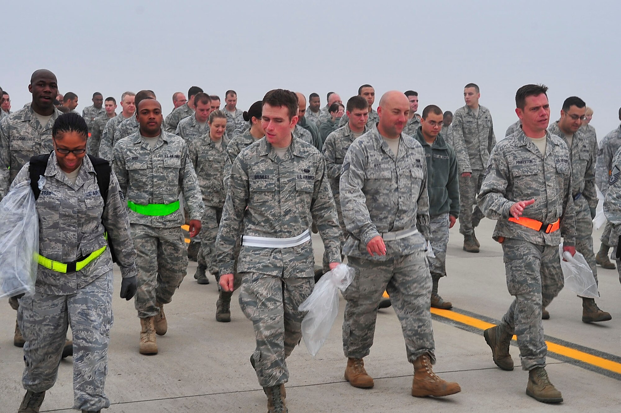 Airmen from the 51st Fighter Wing search for debris during the wing-wide Foreign Object Debris walk on Oct. 11, 2011. Following the construction on Osan Air Base airfield members are ensuring that the flight line is FOD free.  (U.S. Air Force photo/Senior Airman Adam Grant)    