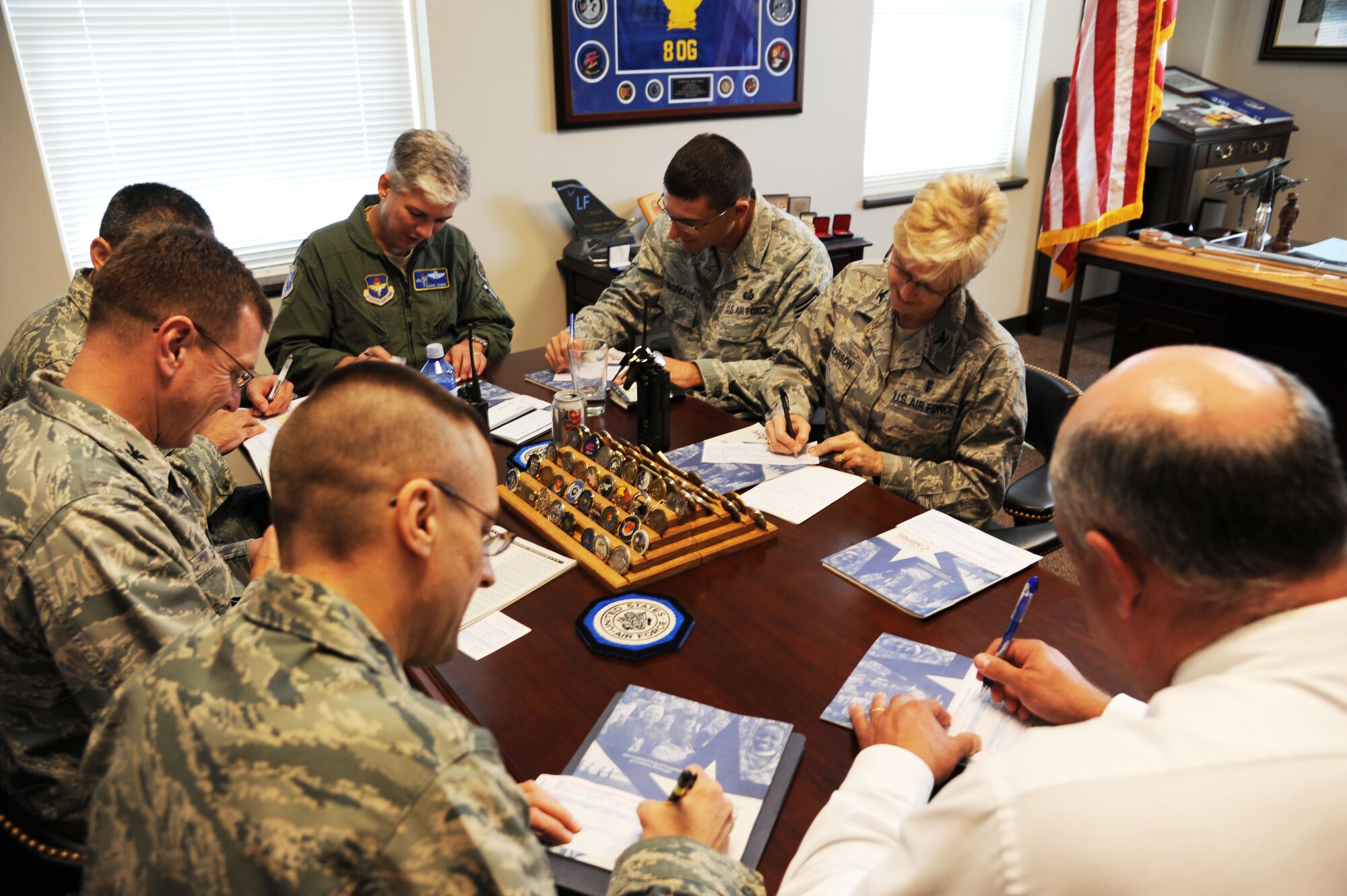 The BLAZE Leadership Team fill in their Combined Federal Campaign forms on Oct. 12 inside the wing commander’s office. The Fiscal Year 2011 CFC spans from Oct. 11 to Nov. 22. (U.S. Air Force photo/Airman 1st Class Chase Hedrick)