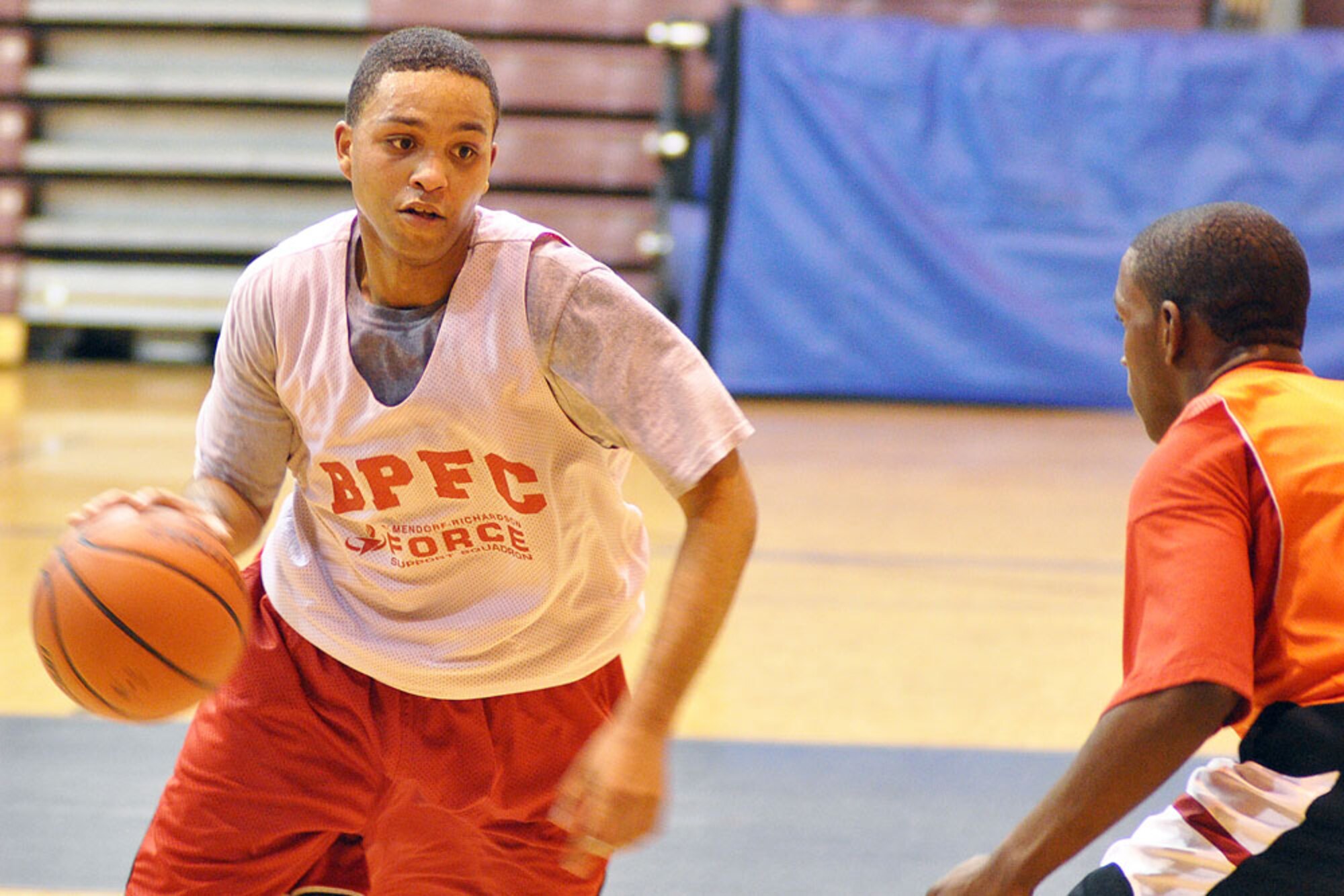 Bobby Lynch (8) looks to drive past the HHB, 2-377th PFAR defense in the opening game of the JBER pre-season basketball tournament at BPFC Monday. Lynch played for HHD, 59th Signal Battalion.  (U.S. Air Force photo/John Pennell)
