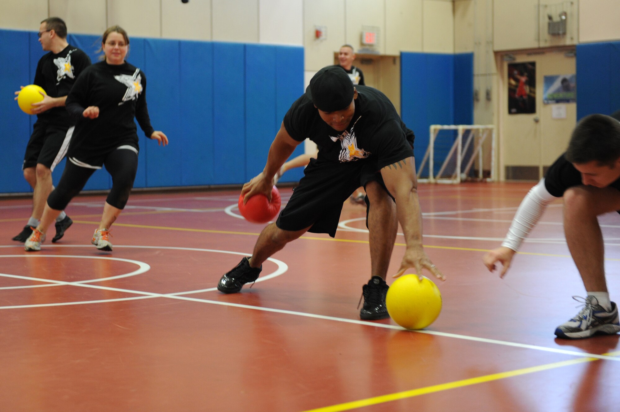 MISAWA AIR BASE, Japan -- Members of the 35th Communication Squadron participate in a dodge ball competition during the wing sports day here Oct. 7. The 35th Fighter Wing held a sports day to promote physical fitness, teamwork, competition, sportsmanship and esprit de corps. The day was kicked off with a 3-mile run followed by various sporting events to include relay races, basketball, softball, ultimate frisbee, soccer and a readiness competition. Approximately 14 units from the base formed teams to participate in each event. (U.S. Air Force photo/Airman 1st Class Kia Atkins)