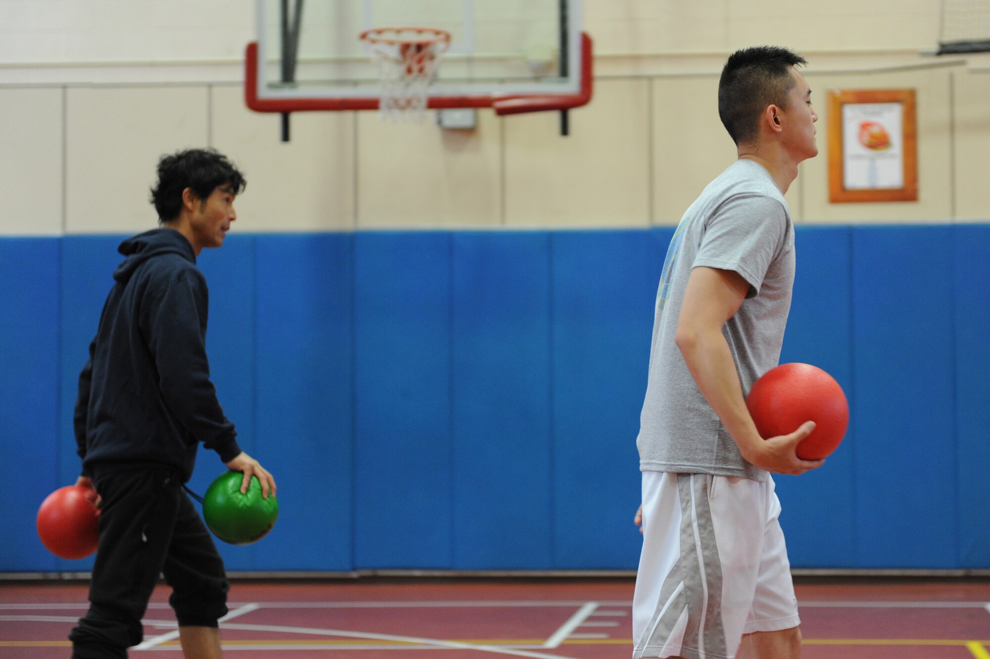 MISAWA AIR BASE, Japan -- Members of the 35th Fighter Wing Staff Agencies compete in a dodge ball competition during the wing sports day here Oct. 7. The 35th Fighter Wing held a sports day to promote physical fitness, teamwork, competition, sportsmanship and esprit de corps. The day was kicked off with a 3-mile run followed by various sporting events to include relay races, basketball, softball, ultimate frisbee, soccer and a readiness competition. Approximately 14 units from the base formed teams to participate in each event. (U.S. Air Force photo/Airman 1st Class Kia Atkins)