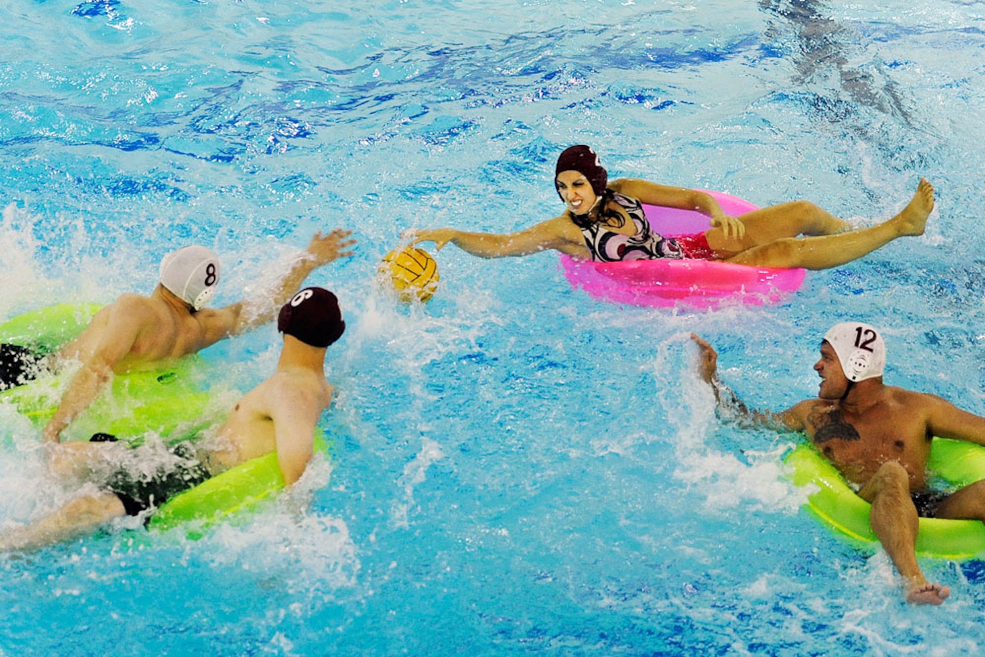 Inner tube water polo competitors scramble to track down a loose ball. (U.S. Air Force photo/John Pennell)