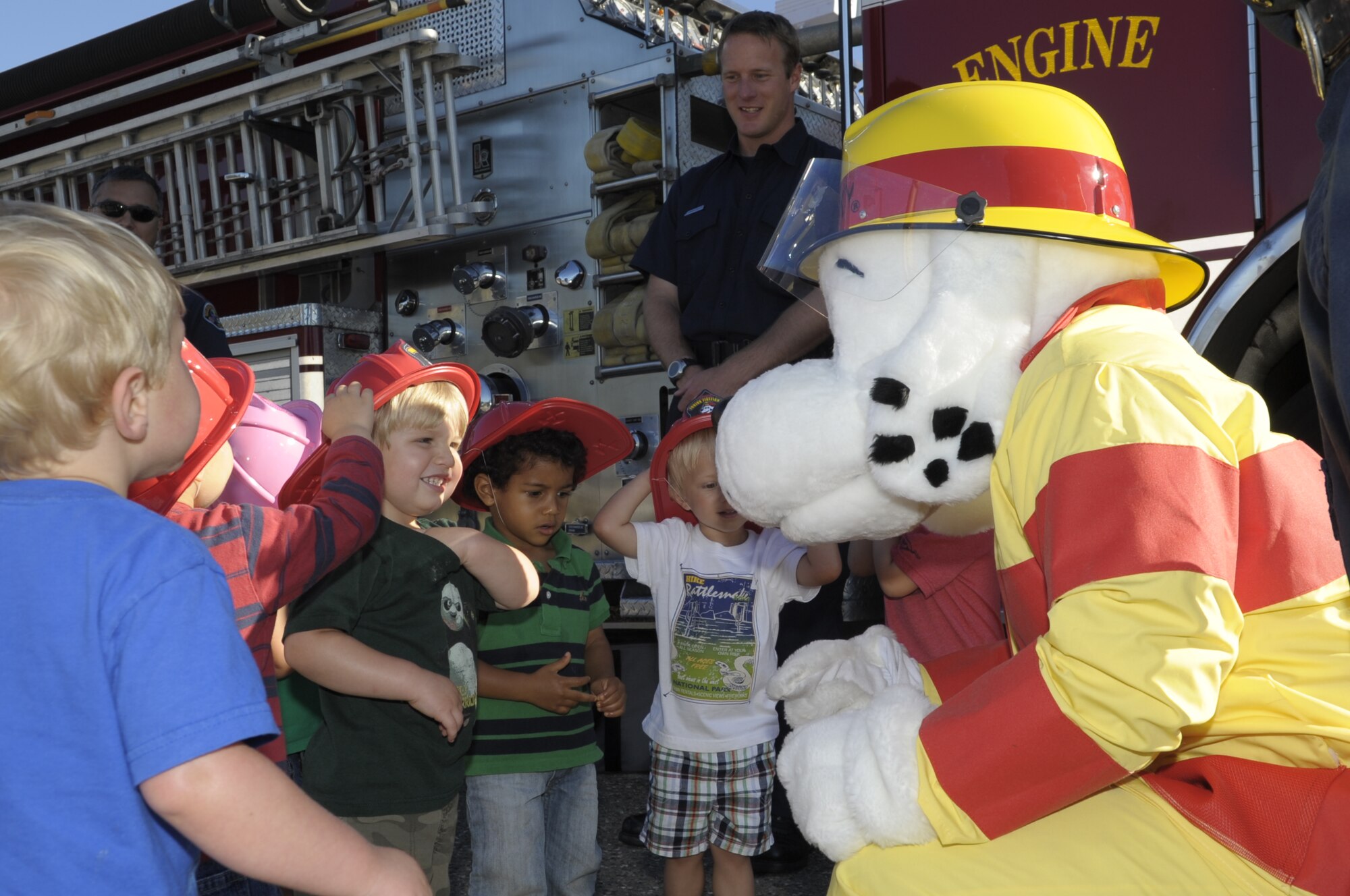 VANDENBERG AIR FORCE BASE, Calif. -- Children from the Vandenberg Child Development Center greet Sparky the Fire Dog here Wednesday, 12 Oct. 2011. Fire Prevention Week runs from Oct. 9-15, and the Vandenberg Fire Department has some great events lined up to promote fire safety awareness. Those events include a parade on Oct. 13 from 5 to 6:30 p.m., a Fire Muster competition Oct. 14 from 10 a.m. to 1 p.m. at the parade grounds here, and cooking fire demonstrations are scheduled for Oct. 15 at 11 a.m. and 1 p.m. at the Vandenberg Exchange.
(U.S. Air Force photo/Jerry E. Clemens, Jr.)