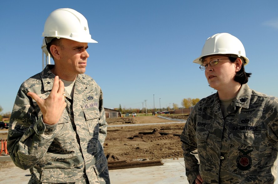 Brig. Gen. Timothy Green, Director of Installations and Mission Support for the U.S. Air Force Air Mobility Command, speaks with Lt. Col. Sara Deaver, 319th Civil Engineering Squadron commander, during his tour of Grand Forks Air Force Base, N.D., on Oct. 11. General Green was at Grand Forks for a site visit and to participate in the U.S. Air Force Expeditionary Center Commander’s Conference. (U.S. Air Force by Senior Airman Amanda N. Stencil)