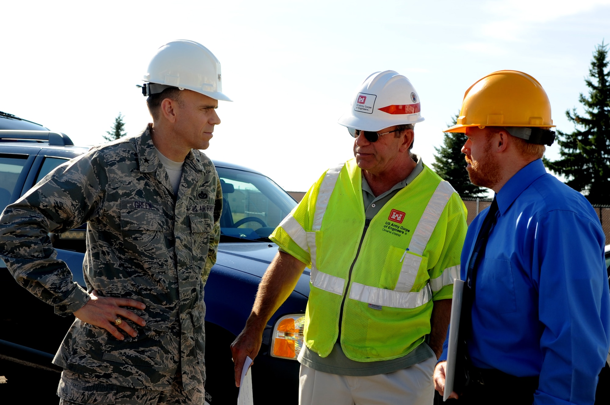 Brig. Gen. Timothy Green, Director of Installations and Mission Support for the U.S. Air Force Air Mobility Command, speaks with Warren Volden (middle), Army Corps of Engineers employee, and Gregory Sturdevant (right), 319th Civil Engineer Squadron, during  a tour of Grand Forks Air Force Base, N.D., on Oct. 11. General Green was at Grand Forks for a site visit and to participate in the U.S. Air Force Expeditionary Center Commander’s Conference. (U.S. Air Force photo by Senior Airman Amanda N. Stencil)
