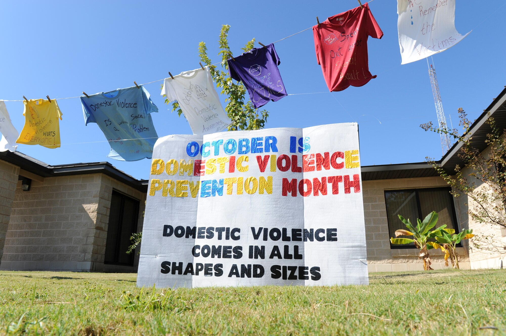 The Clothesline Project is a vehicle for women affected by violence to express their emotions by decorating a shirt. They hang the shirt on a clothesline to be viewed by others as testimony to the problem of violence against women and children. With the support of many, it has since spread world-wide and is displayed on Tyndall in front of Bldg. 1404, Mental Health Clinic. White represents those who have died as a result of domestic violence. Yellow represents those who were battered or assulated. Red, pink, or orange represents those who were raped or sexually assualted. Blue and green represents survivors of incest. Purple represents those who were attacked for their sexual orientation or identification. (U.S. Air Force photo by Lisa Norman) 