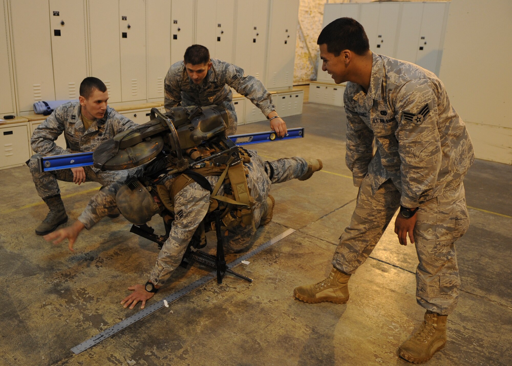 MINOT AIR FORCE BASE, N.D. -- 91st Security Forces Group Tactical Response Force Airmen participate in a doctoral physical assessment here, Sept. 9. TRF volunteers performed exercises with and without full battle gear to demonstrate how the gear makes movement difficult. These volunteers are currently participating in a doctoral study which assesses any physical weaknesses or injuries they may have. The assessment can potentially reduce injuries in the Air Force. (U.S. Air Force photo/Senior Airman Ashley N. Avecilla)