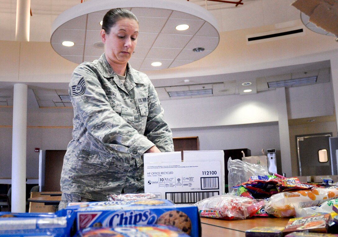 TSgt Allie Truax volunteers her time to assemble a variety of care packages for deployed members of the 138th Fighter Wing, Oklahoma Air National Guard, Tulsa OK.  Members of the 138th Fighter Wing were deployed to Southwest Asia on Wednesday, 28 September 2011 in support of Operation New Dawn. 